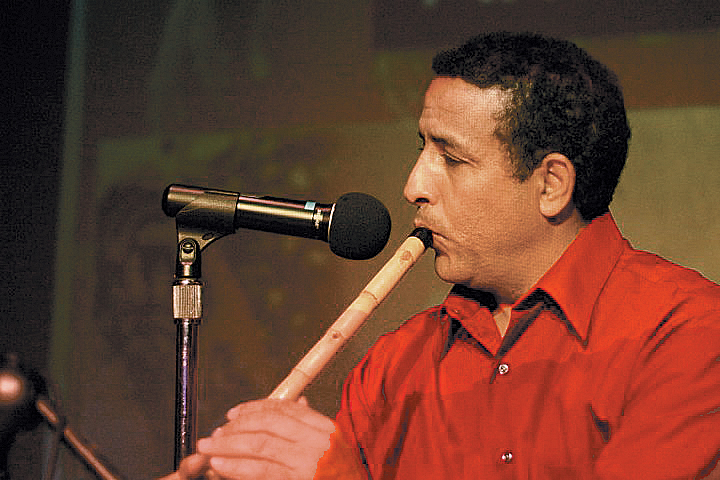 Boujemaa Razgui playng one of his flutes.
