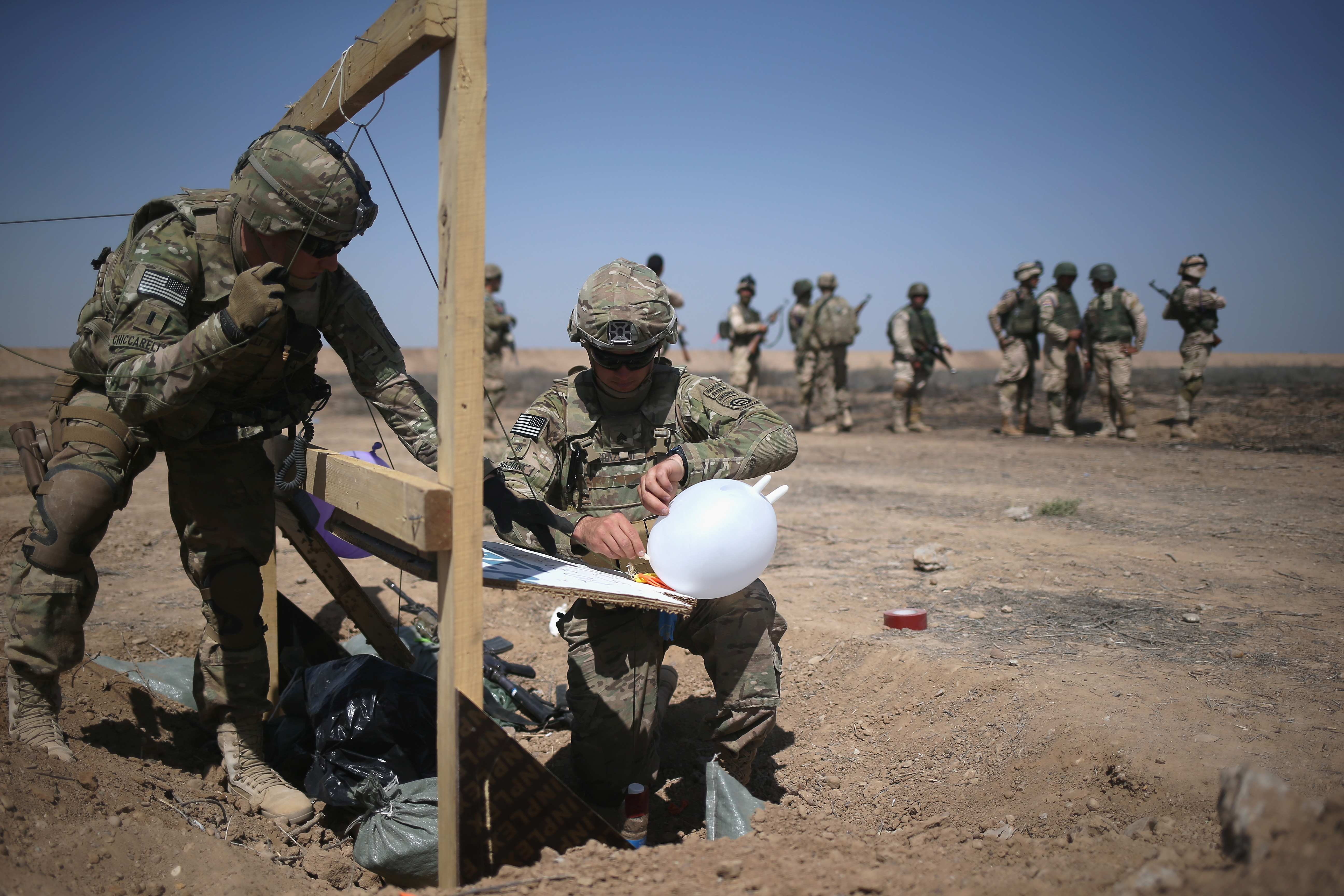 US Army trainers set up targets at a base in Taji, Iraq, in April.