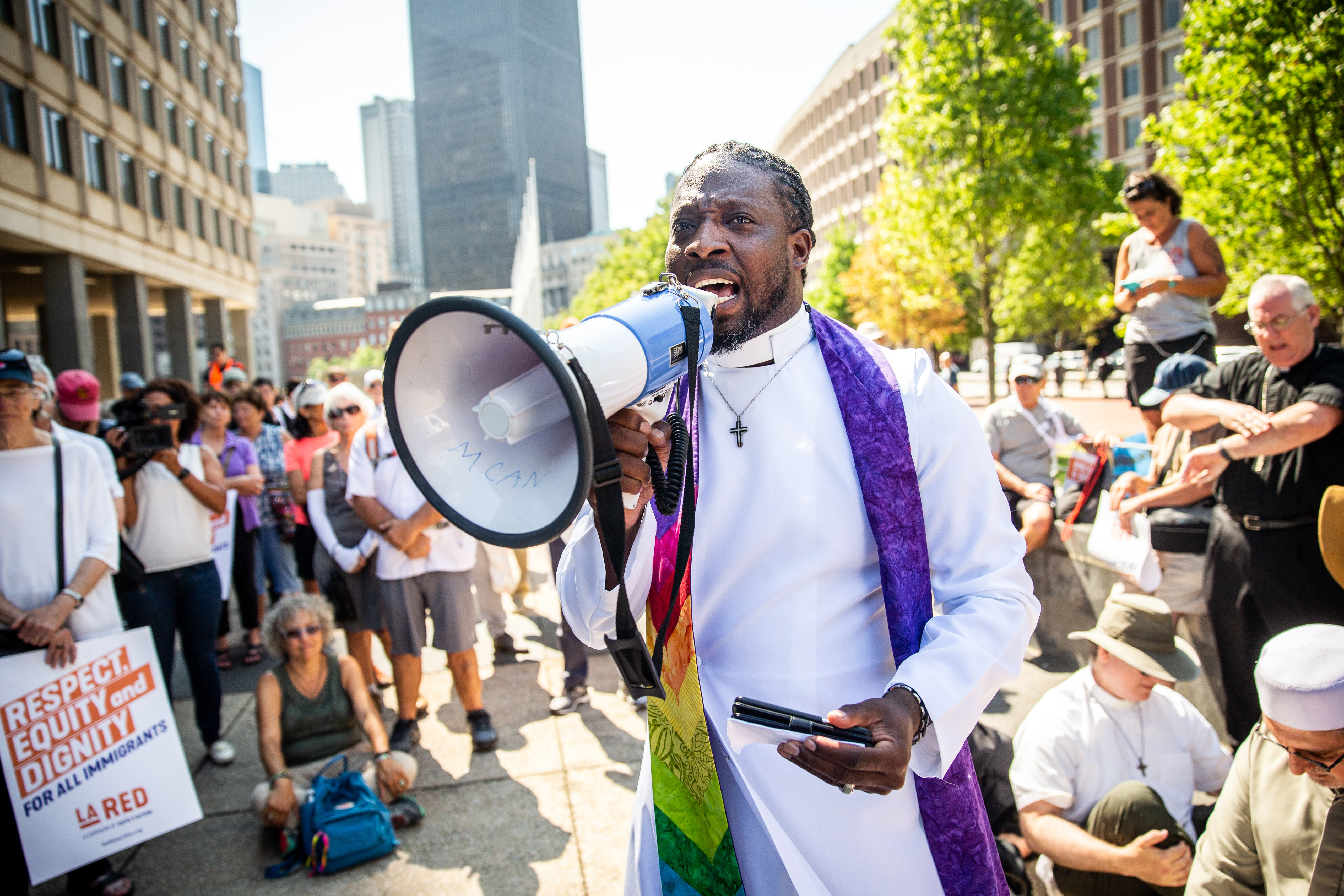 Pastor Andre Bennett spoke outside the JFK Federal Building in Boston during a gathering to protest ICE detention policies.