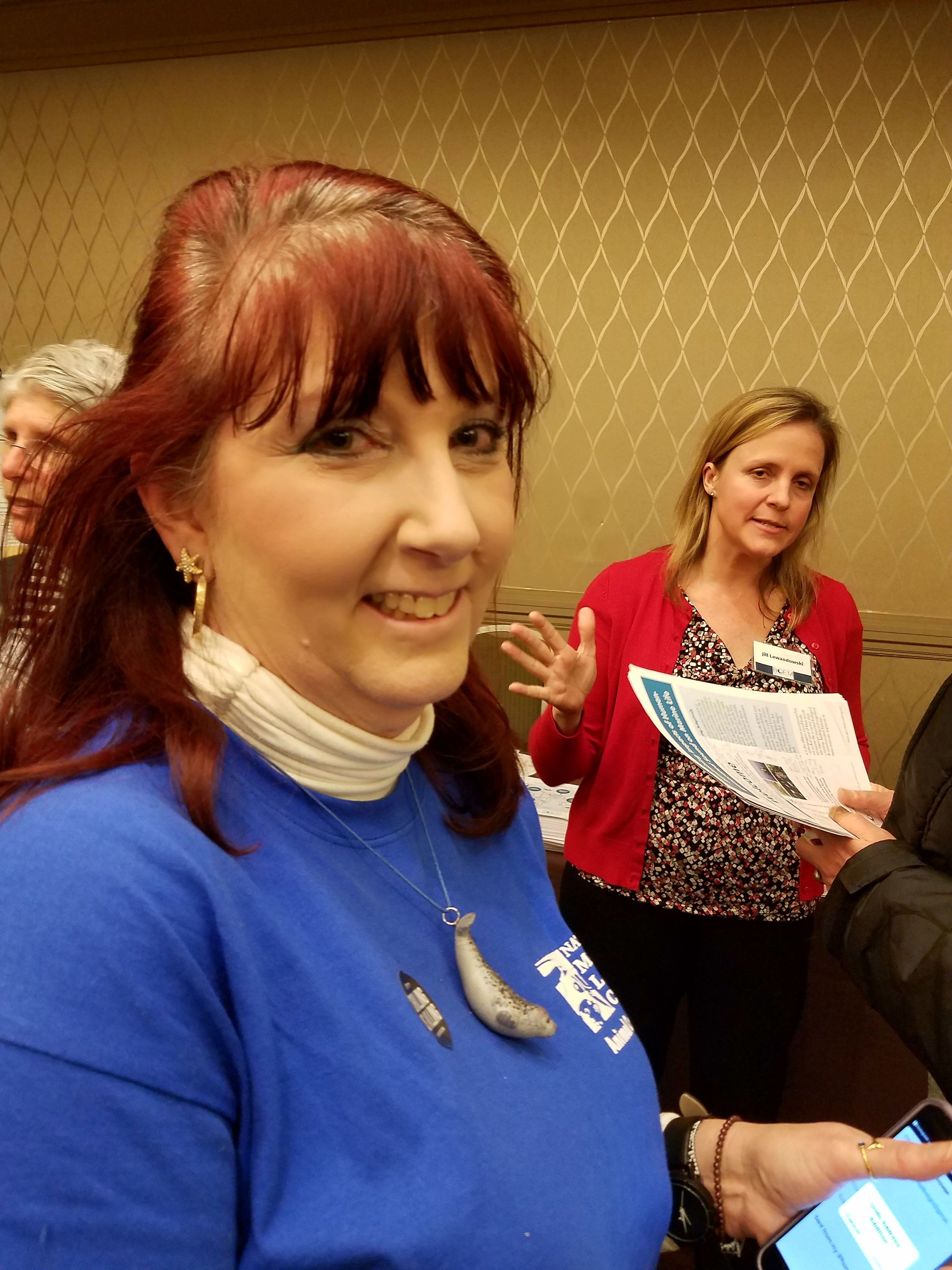 Meghan O'Reilly, 59, of Newport and Jill Lewandowski, a biologist from the Bureau of Ocean Energy Management, joined protesters at the Sheraton Hotel in Boston.
