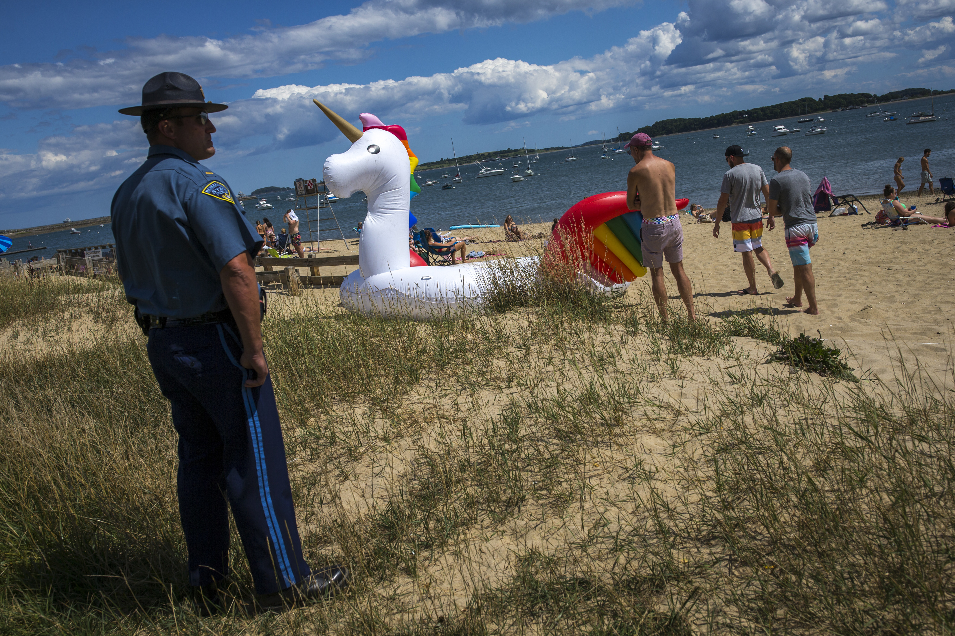 State Police Lieutenant Sean Newman ordered beachgoers to remove their inflatable unicorn from M Street Beach.
