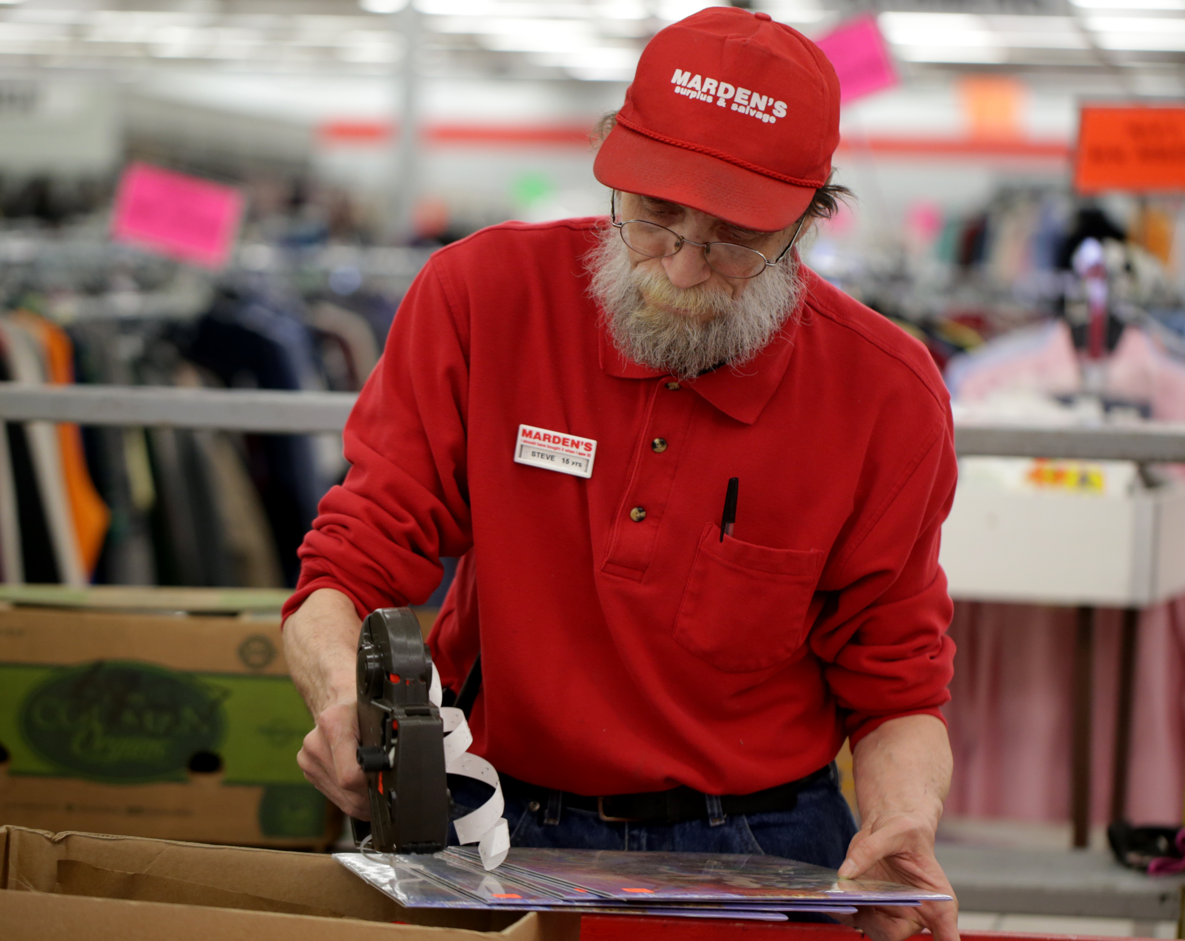Steve Quellette tagged calenders at Marden’s Surplus & Salvage in Scarborough, Maine — an outlet that also had plenty of chairs and sneakers. Marden’s also does online auctions.