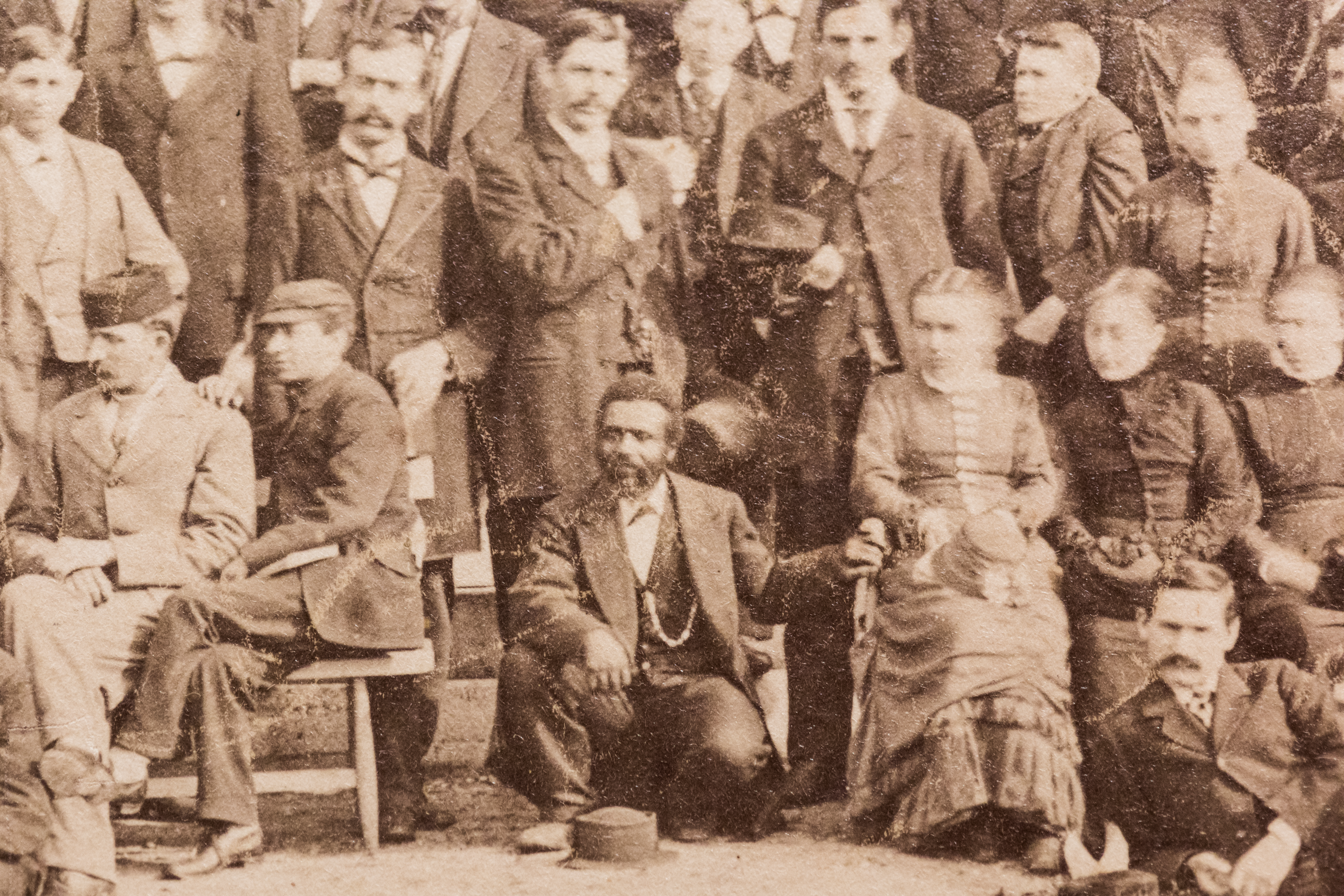 A photograph of a historic class photo, circa 1882, of Samuel Osborne (center).