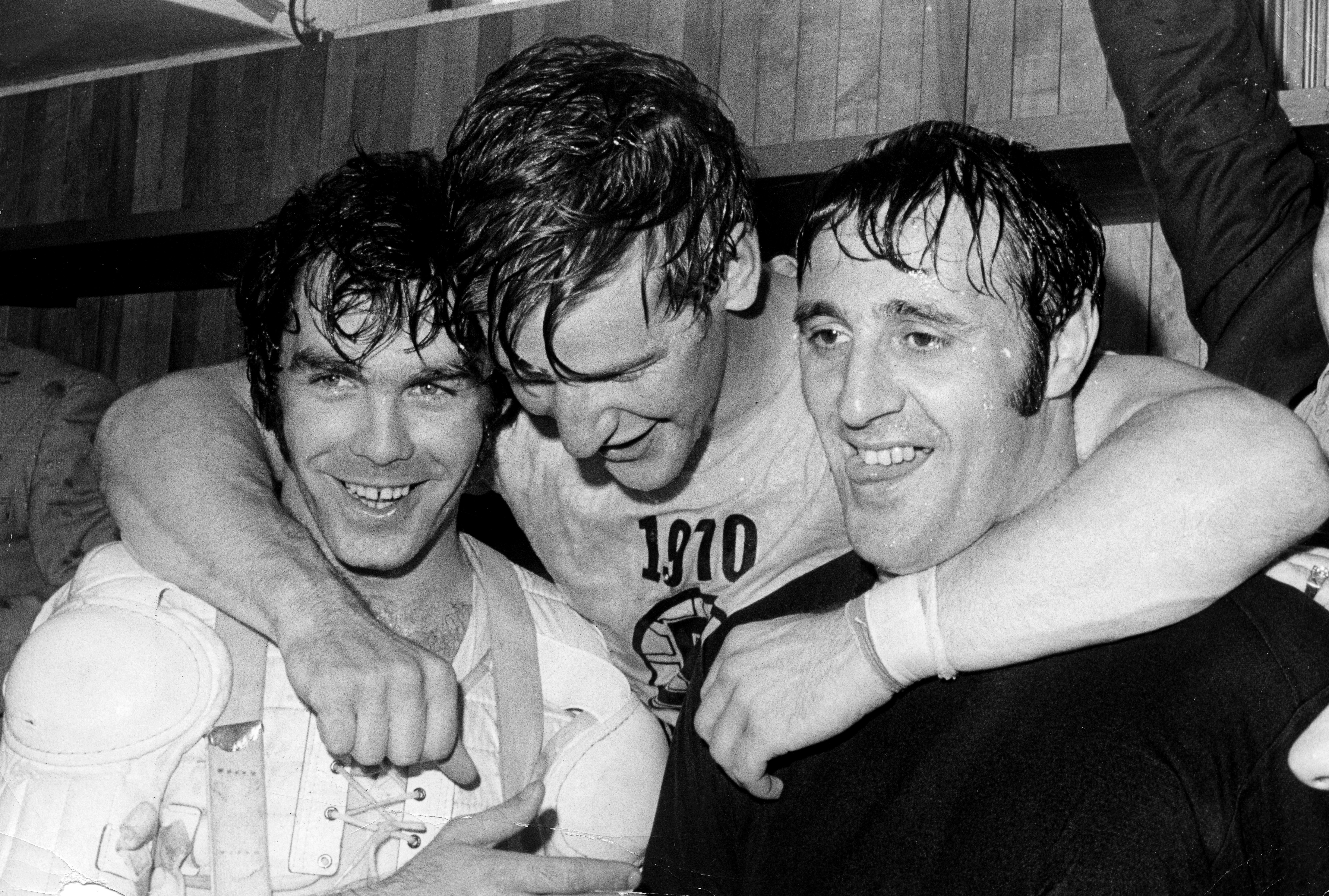 Orr (center) with teammates Derek Sanderson and Phil Esposito after winning the Stanley Cup in 1970.