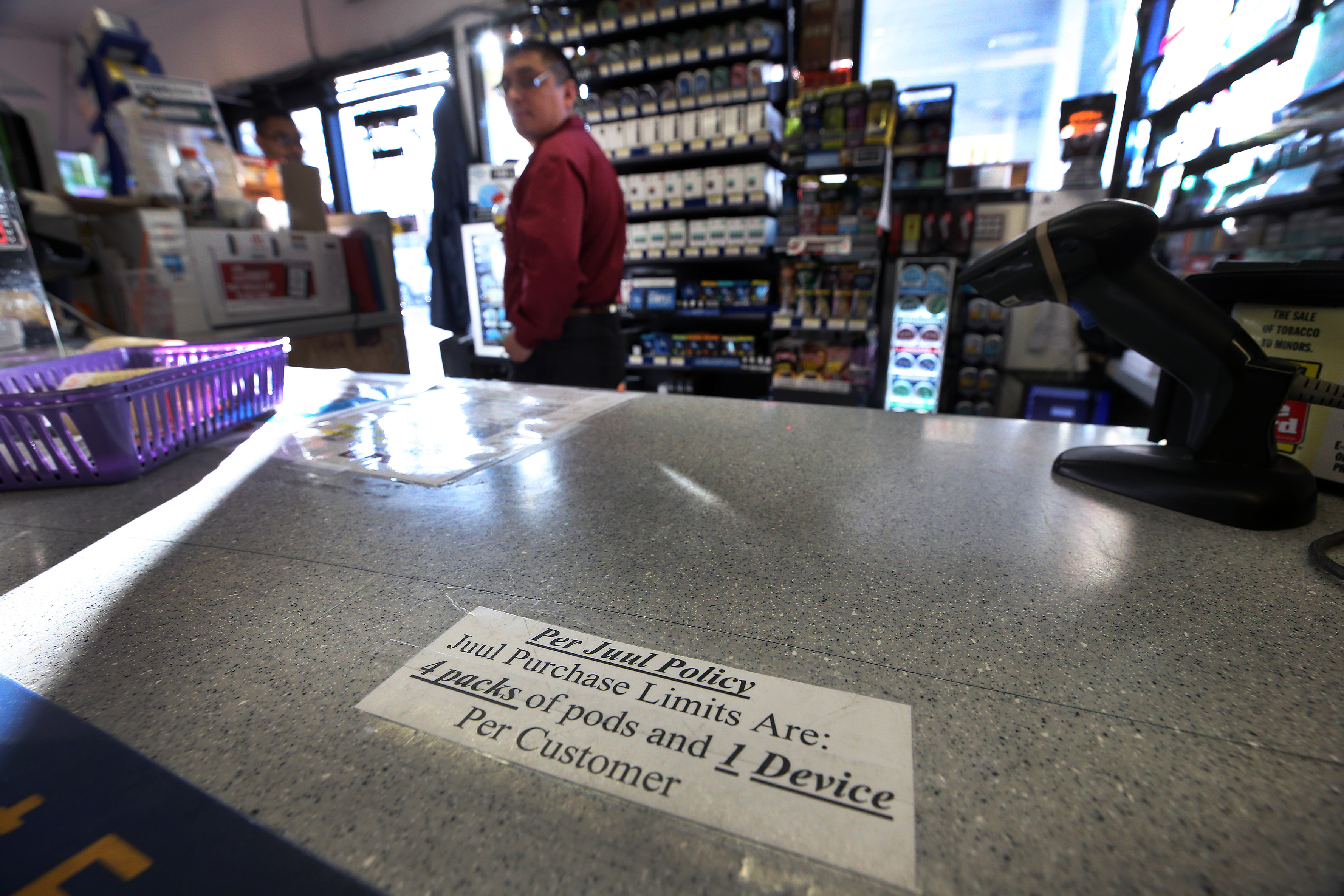A sign on the counter at Nashua Gulf on Daniel Webster Highway lets customers know that Juul policy restricts the number of products that they can purchase at one time.