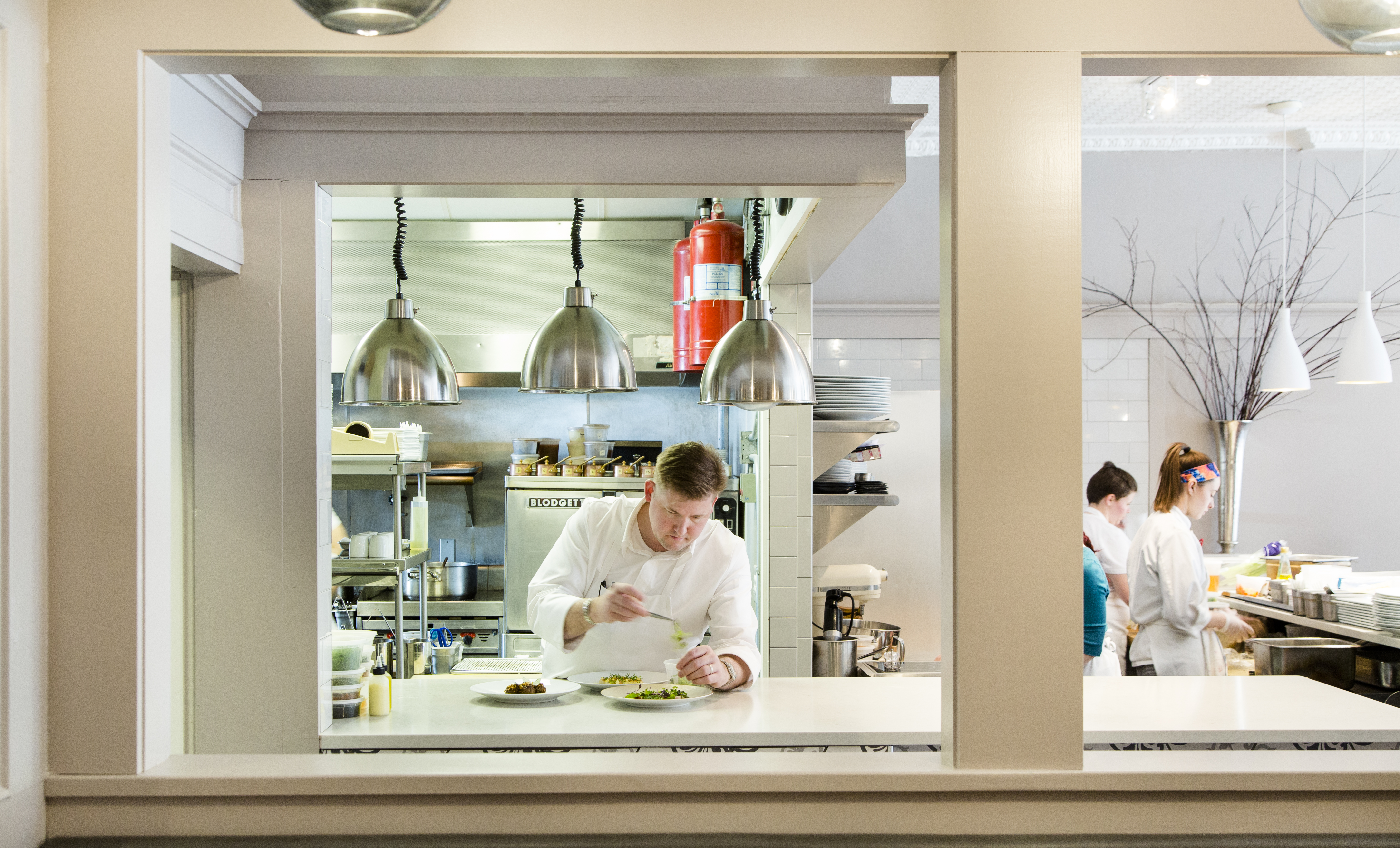 Champe Speidel at work in the kitchen of his restaurant Persimmon, which kept its name after moving, but is otherwise completely re-imagined.