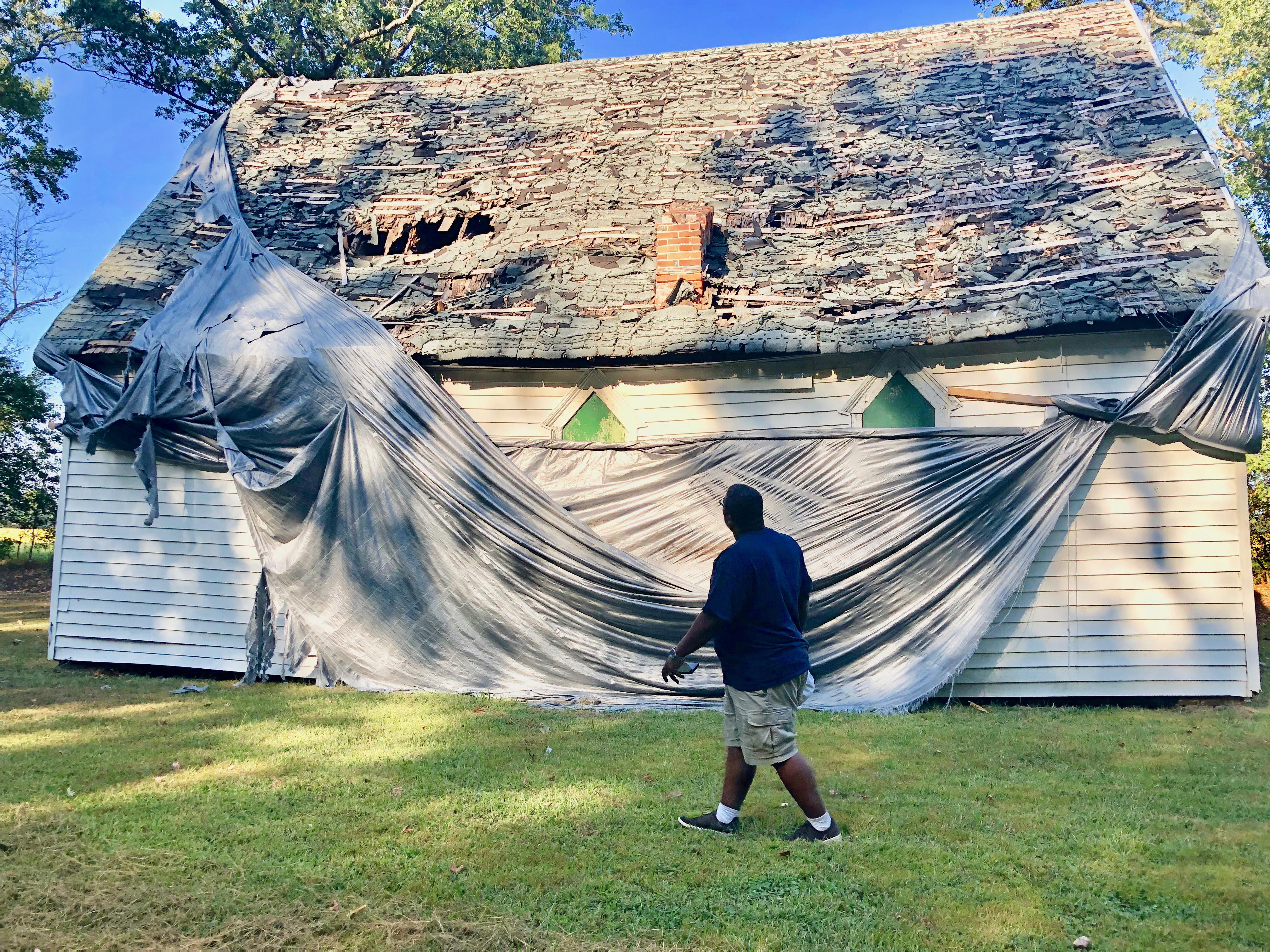 Alex Green walks by the deteriorating Bazel Church. Green and his wife, Lisa, have been giving tours of the significant Tubman sites for the past two years.