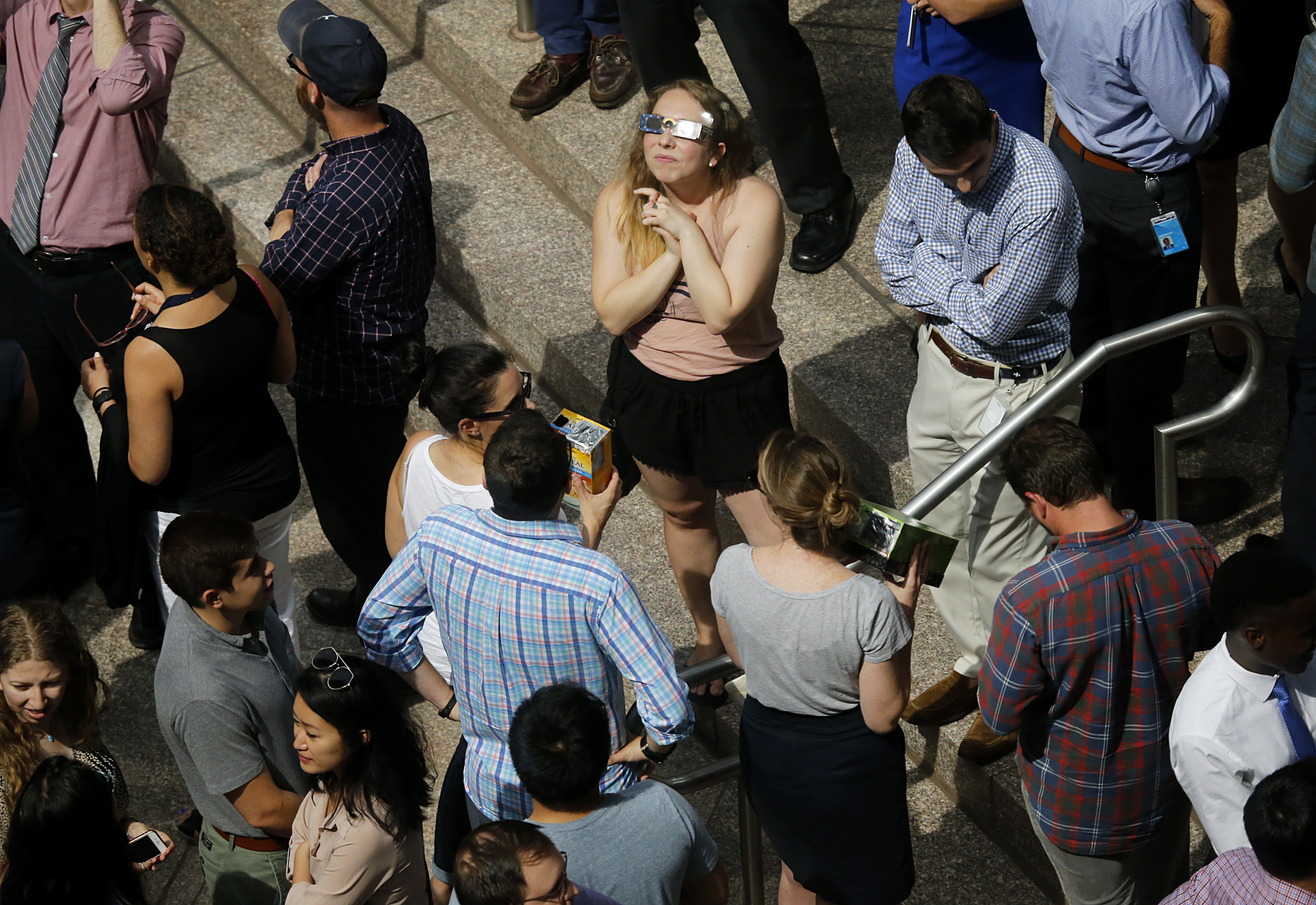 Workers stared at the eclipse at the entrance to 1 Exchange Place.