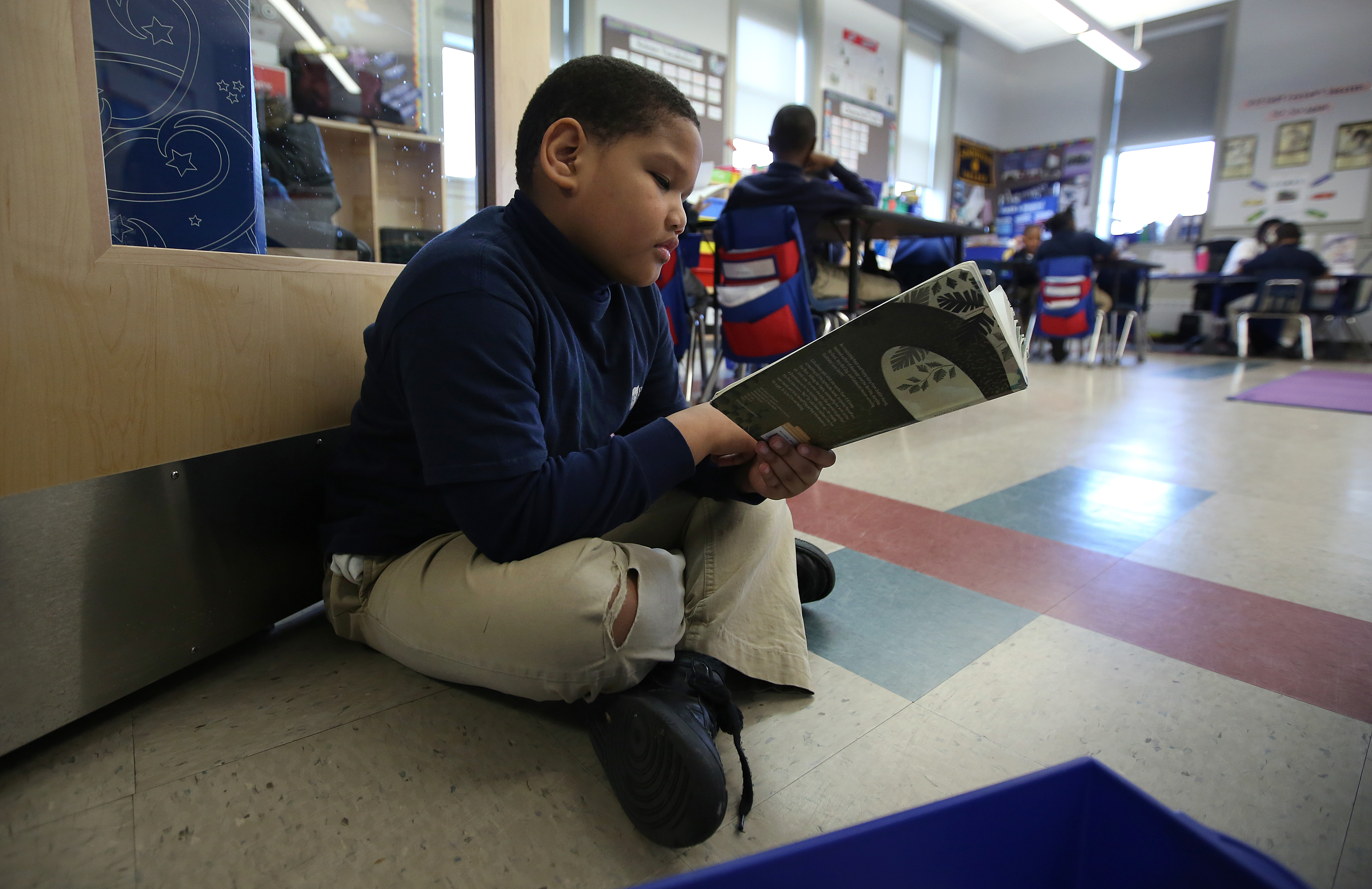 Second-grader Giovany Fernandes was comfortable during independent reading at the Brooke Charter School in Mattapan.