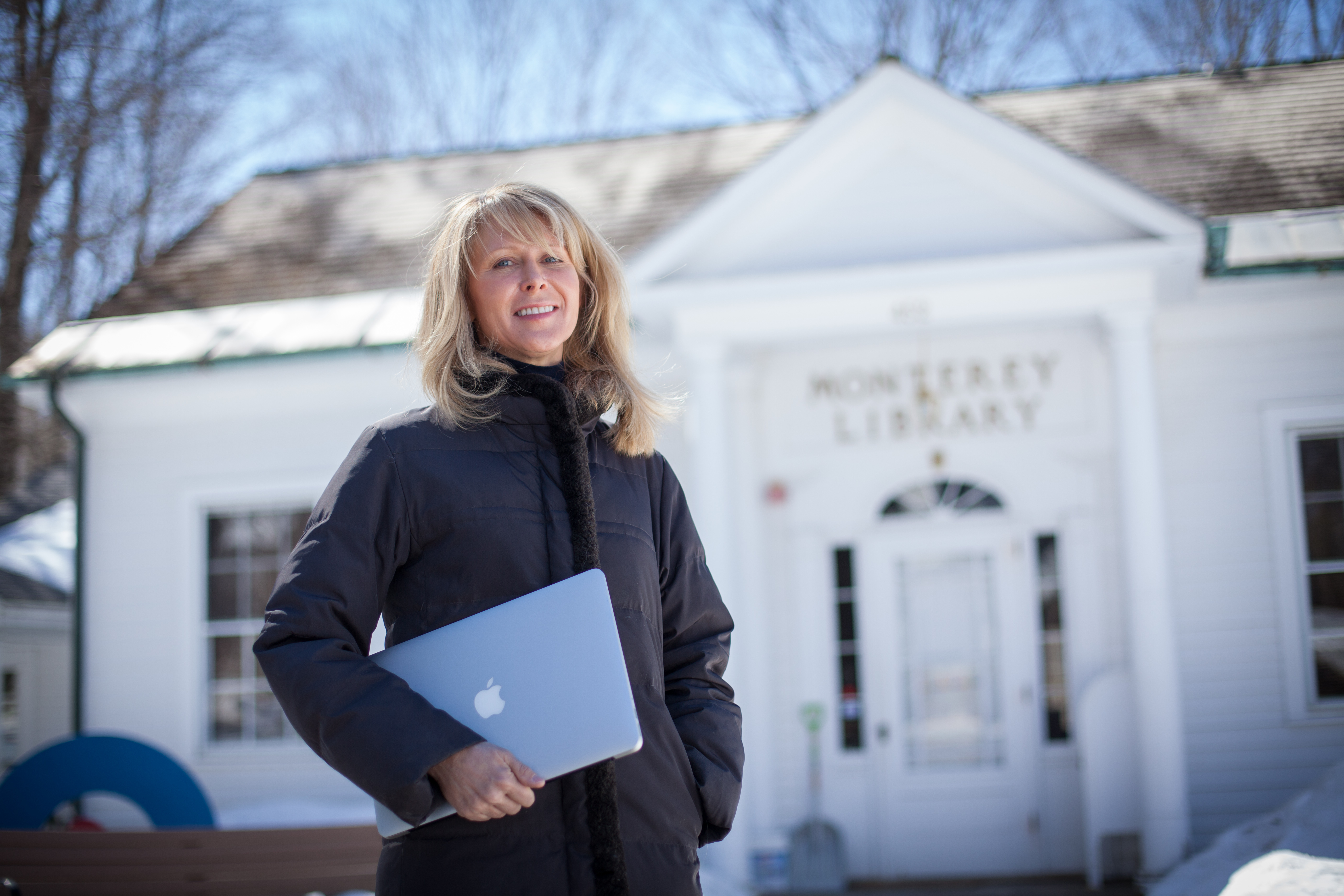 Broadband advocate Monica Webb stands outside the Monterey Public Library, which offers residents’ only access to the Internet via free Wi-Fi.
