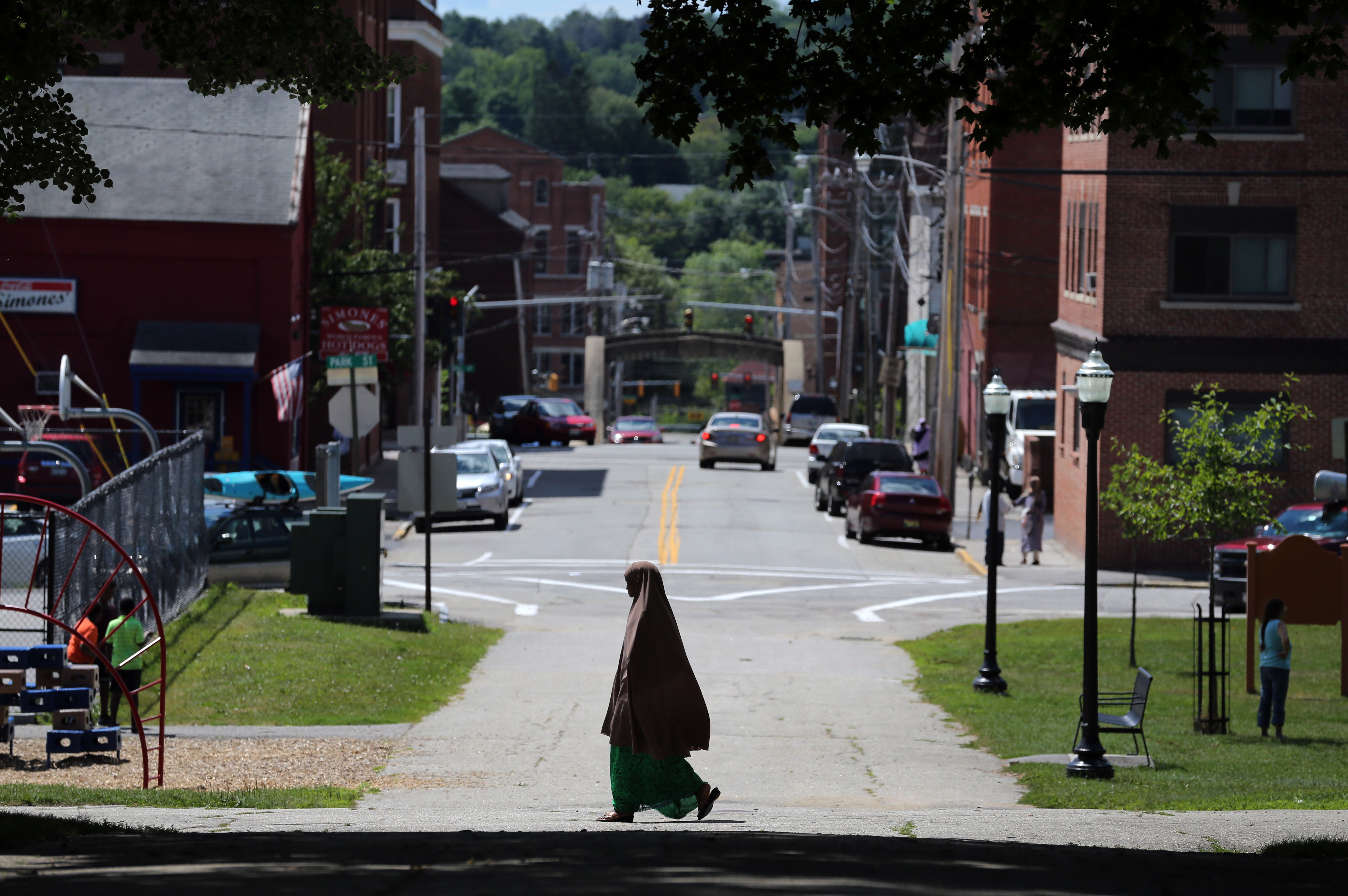 A Somali woman passed through Kennedy Park in Lewiston, Maine earlier this month.