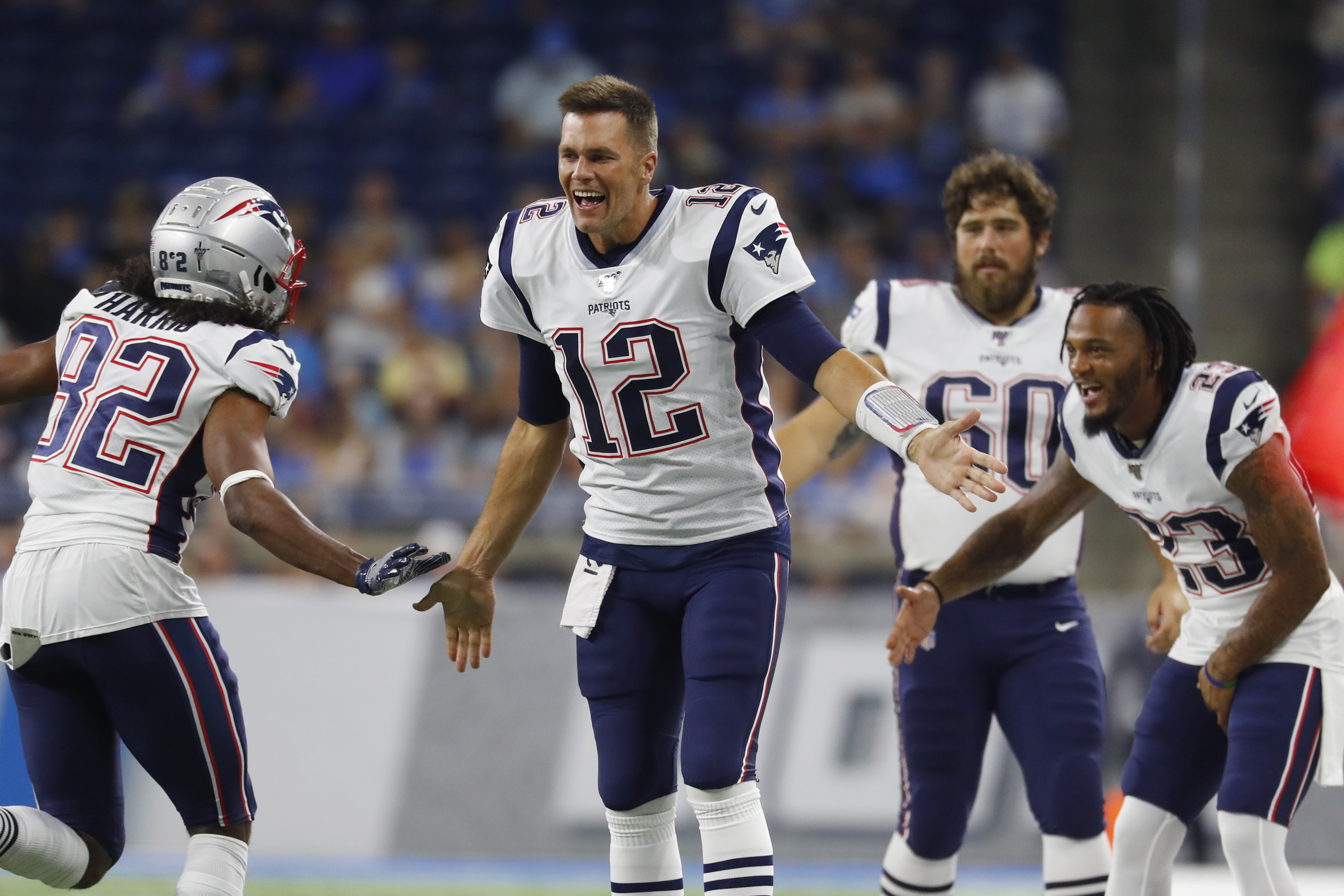 Tom Brady celebrated with teammates during the Patriots’ preseason game against the Lions on Thursday.