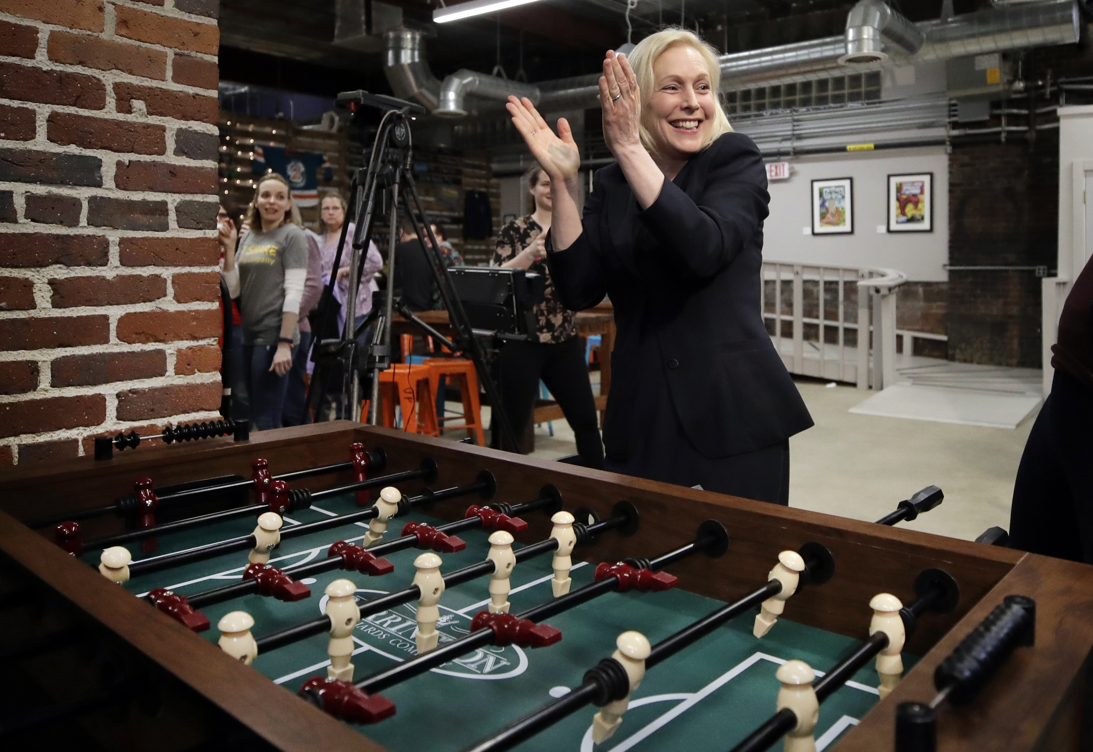 Democratic presidential candidate Senator Kirsten Gillibrand celebrated her foosball victory at a campaign meet-and-greet Friday in Manchester, N.H.