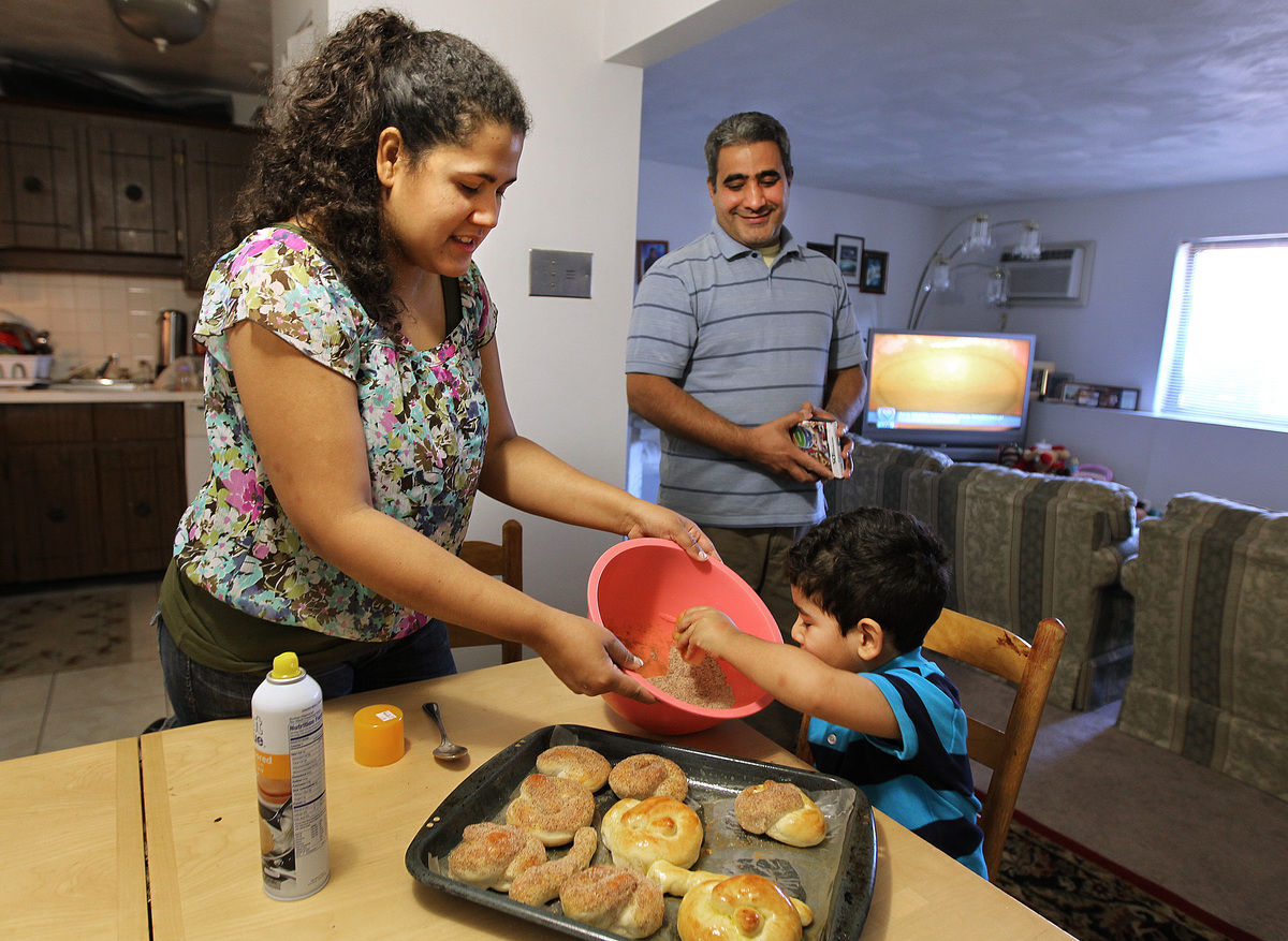Only after the Globe asked about his status did officials allow Mauricio Perozin to remain in the United States for another year. His wife Lisia made pretzels with their 4-year-old son Misael.
