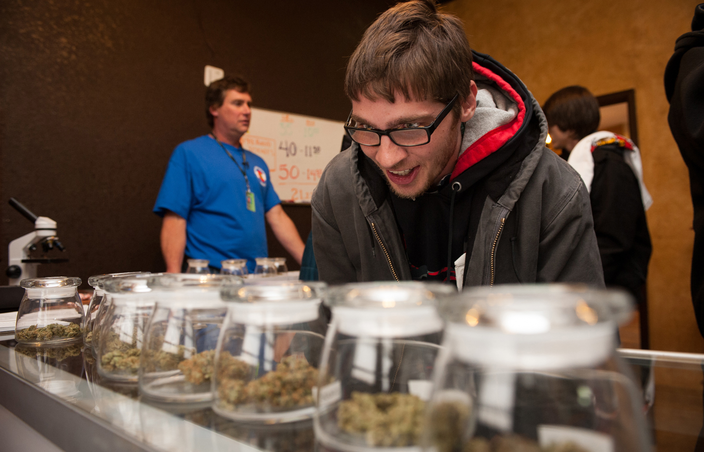 Tyler Williams of Blanchester, Ohio, selected marijuana varieties to buy on New Year’s Day at a dispensary in Denver.