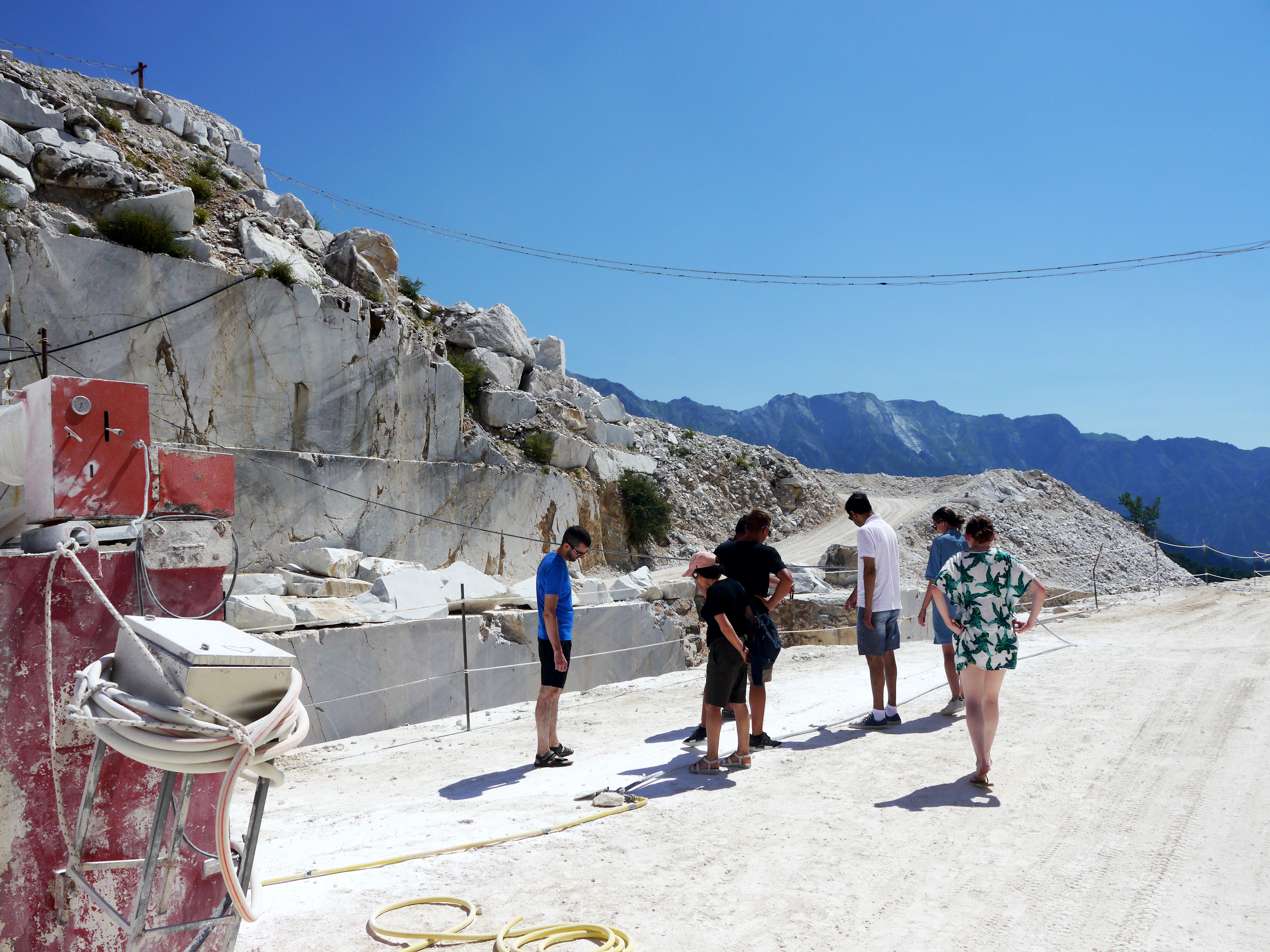 The tour stops to look at a recent cut in the marble.