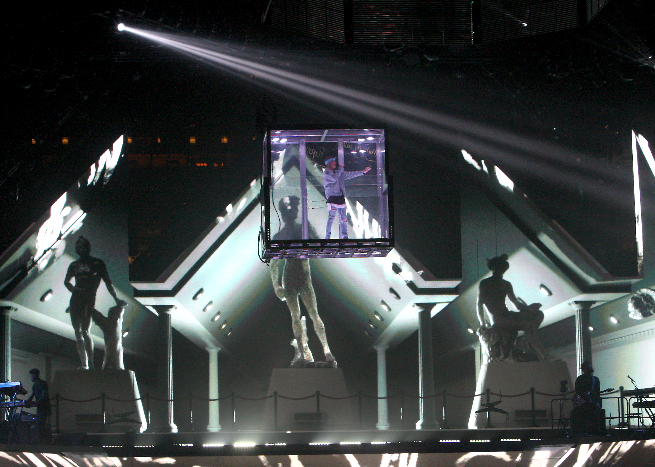 During one song, Bieber was encased in a Plexiglass box.