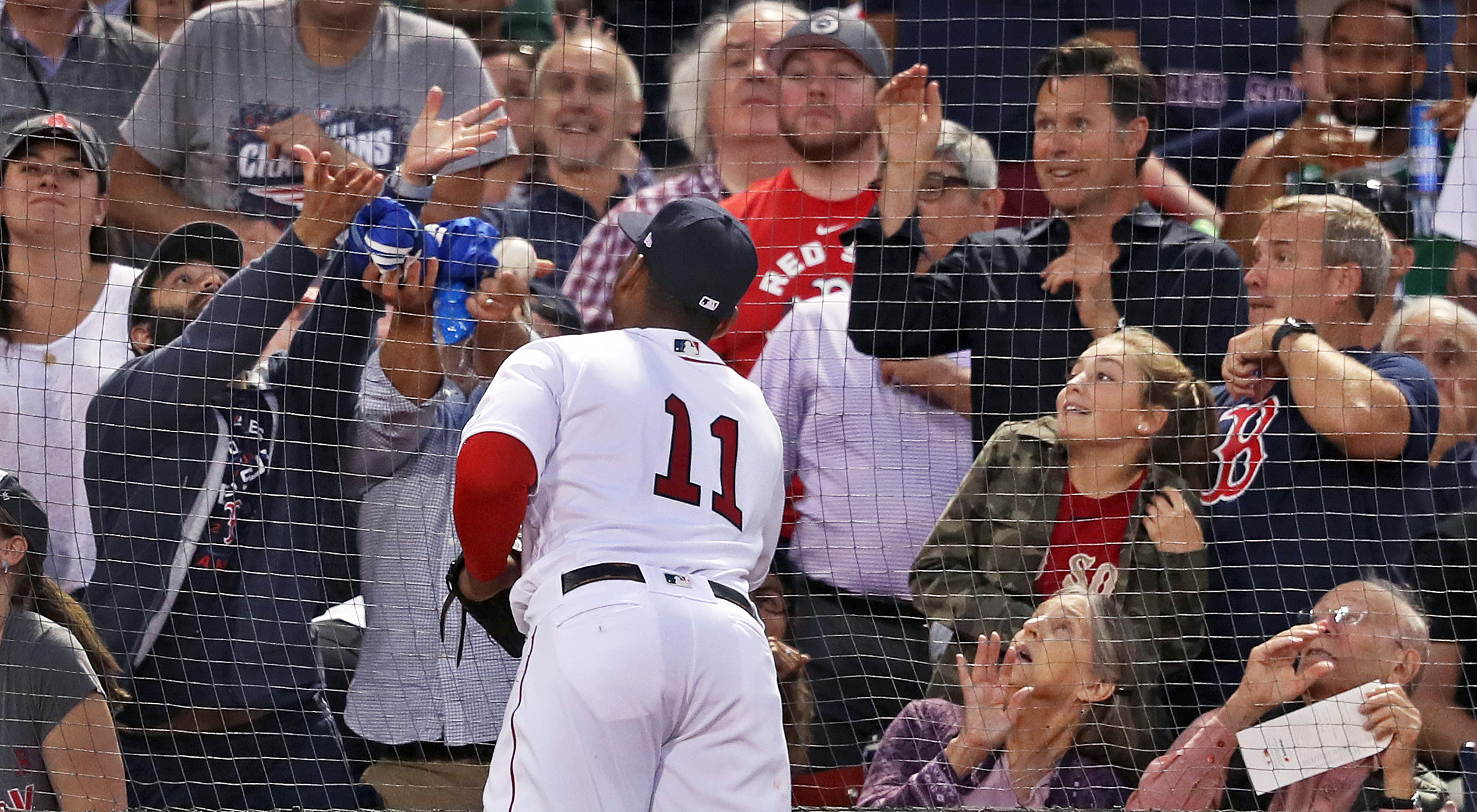 Rafael Devers, seen here looking to make a play on a foul ball in a September game, got some defensive tips from Adrian Beltre this past year.