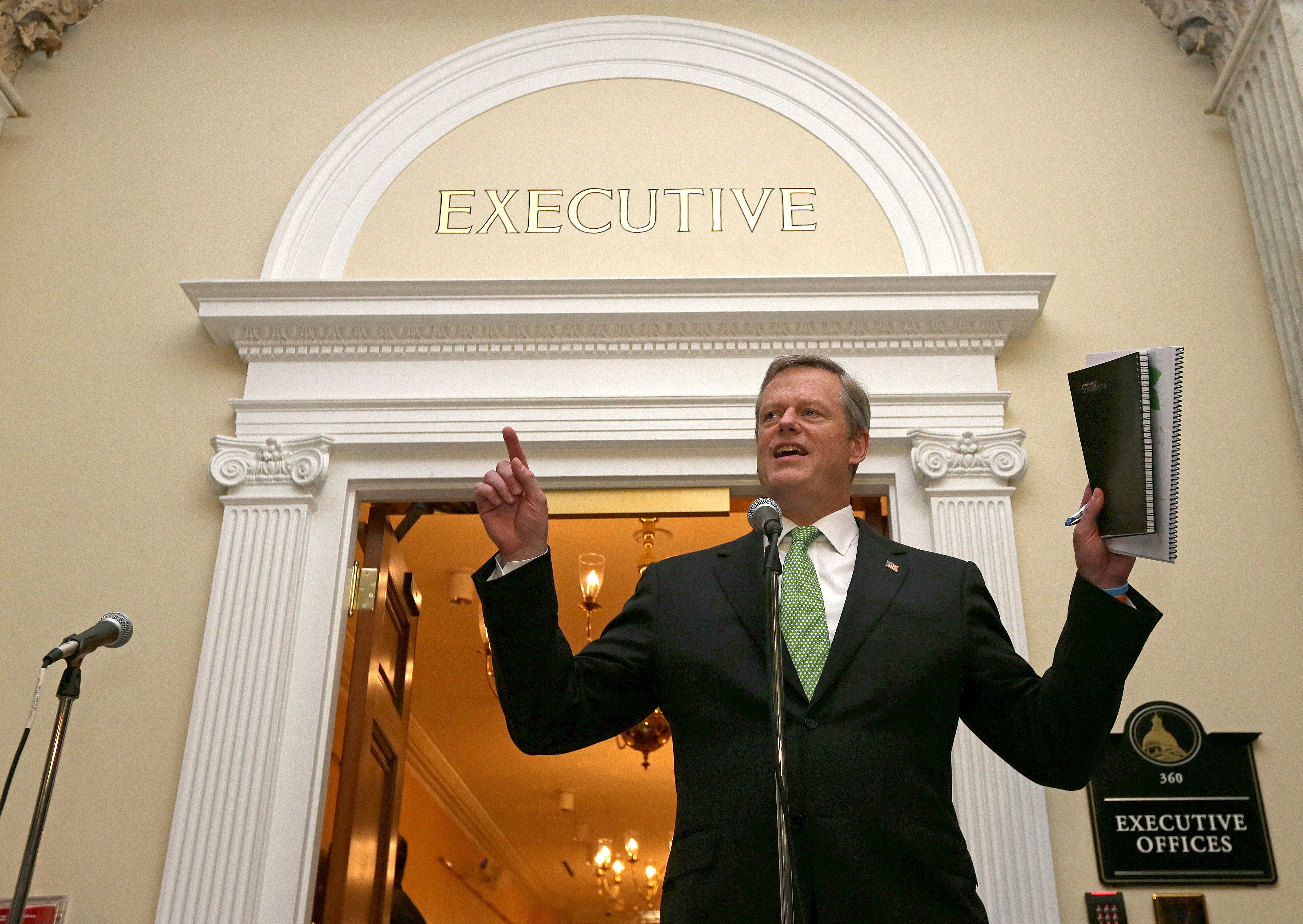 Baker met with the press outside the executive office after former Massachusetts governors Dukakis and Weld met with him about a link between North and South stations.