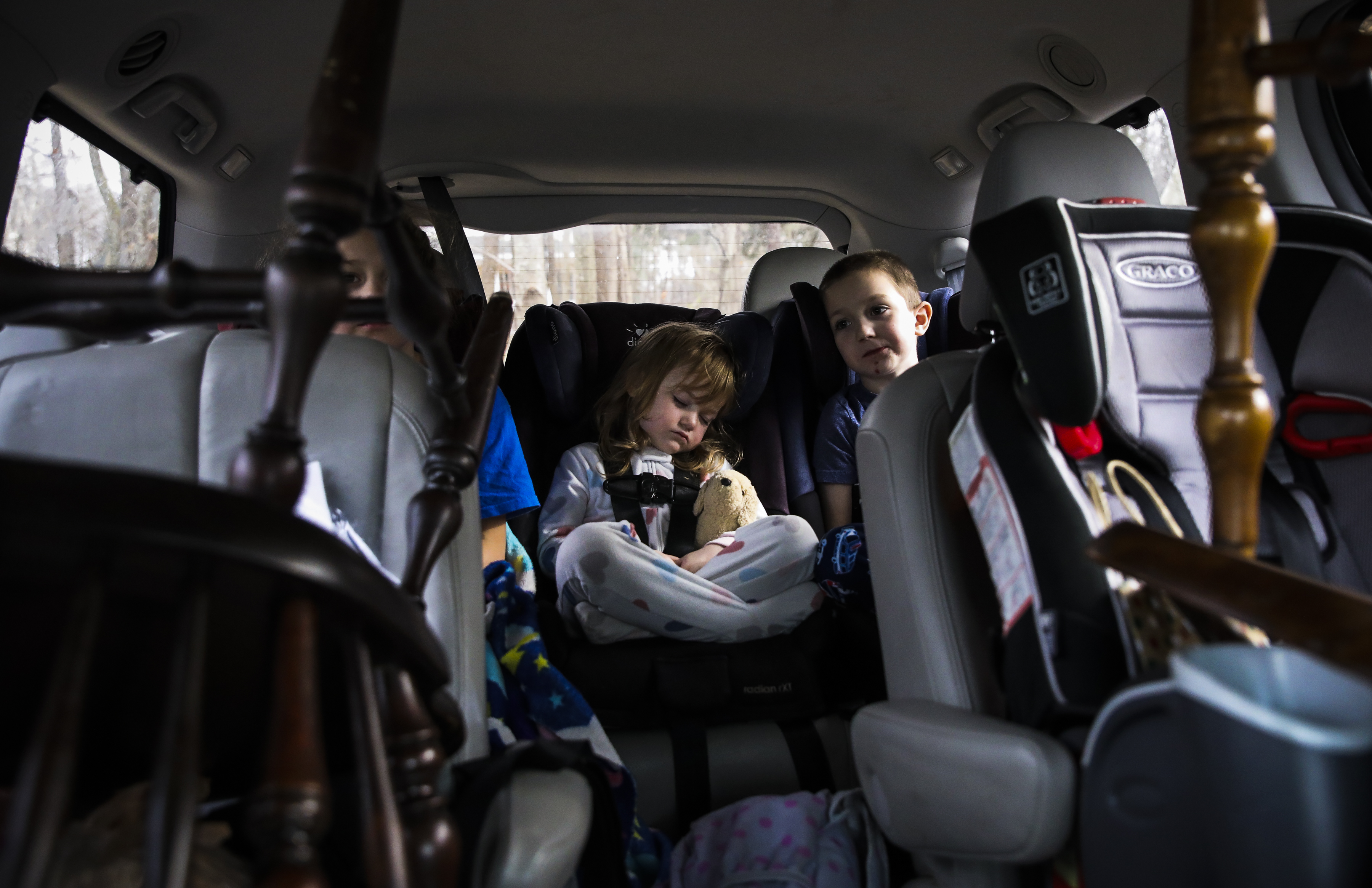 Laya slept in the back of the van with her siblings amid dining room chairs and various odds and ends en route to the Lupiens’ new apartment in New Hampshire.
