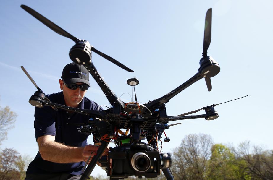 Matthew Murphy, president of Boston Virtual Imaging, prepared his drone for flight in Wellesley.