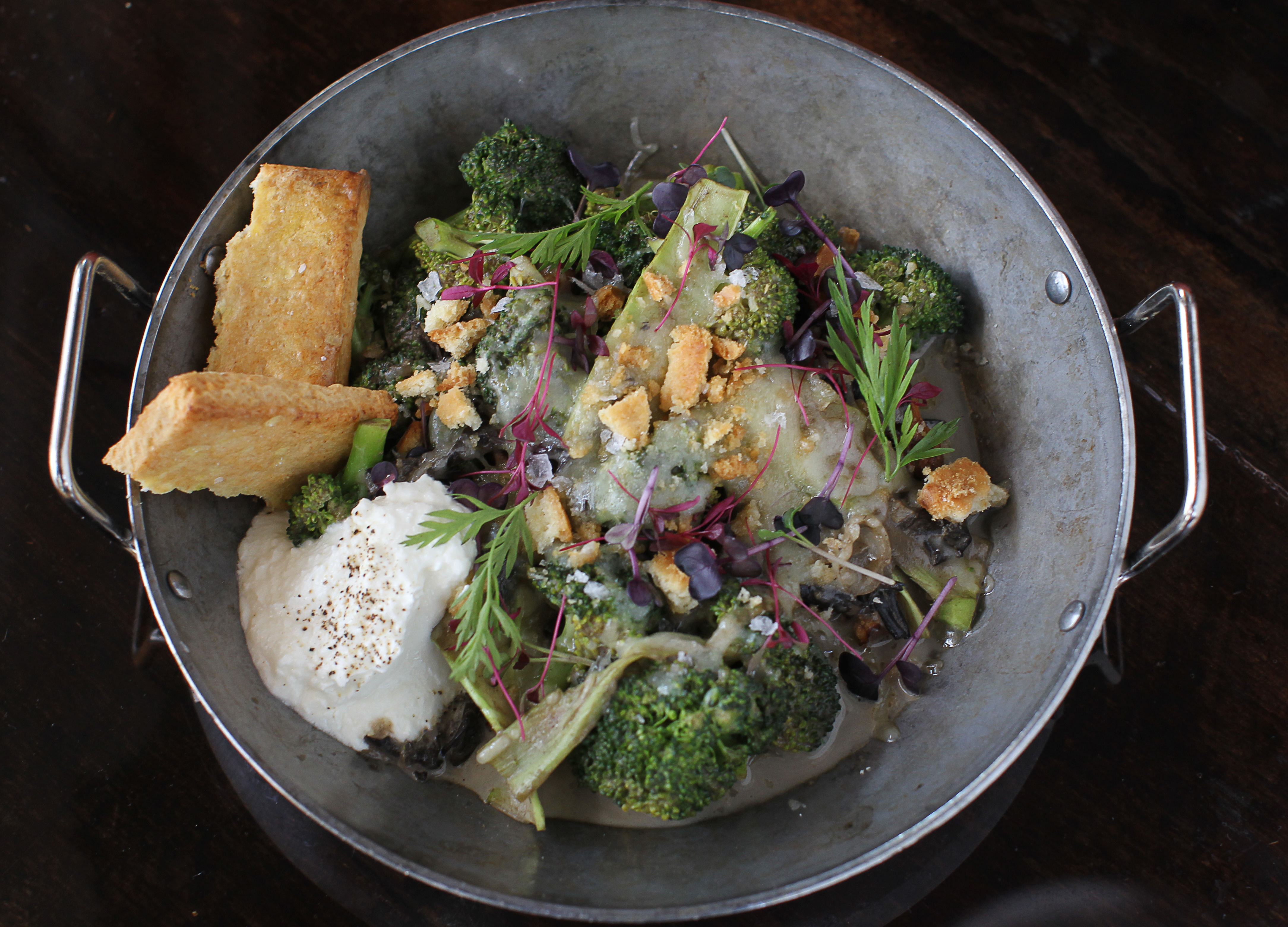Broccoli casserole includes homemade crackers, wild mushrooms, and soft mounds of Comte cheese.