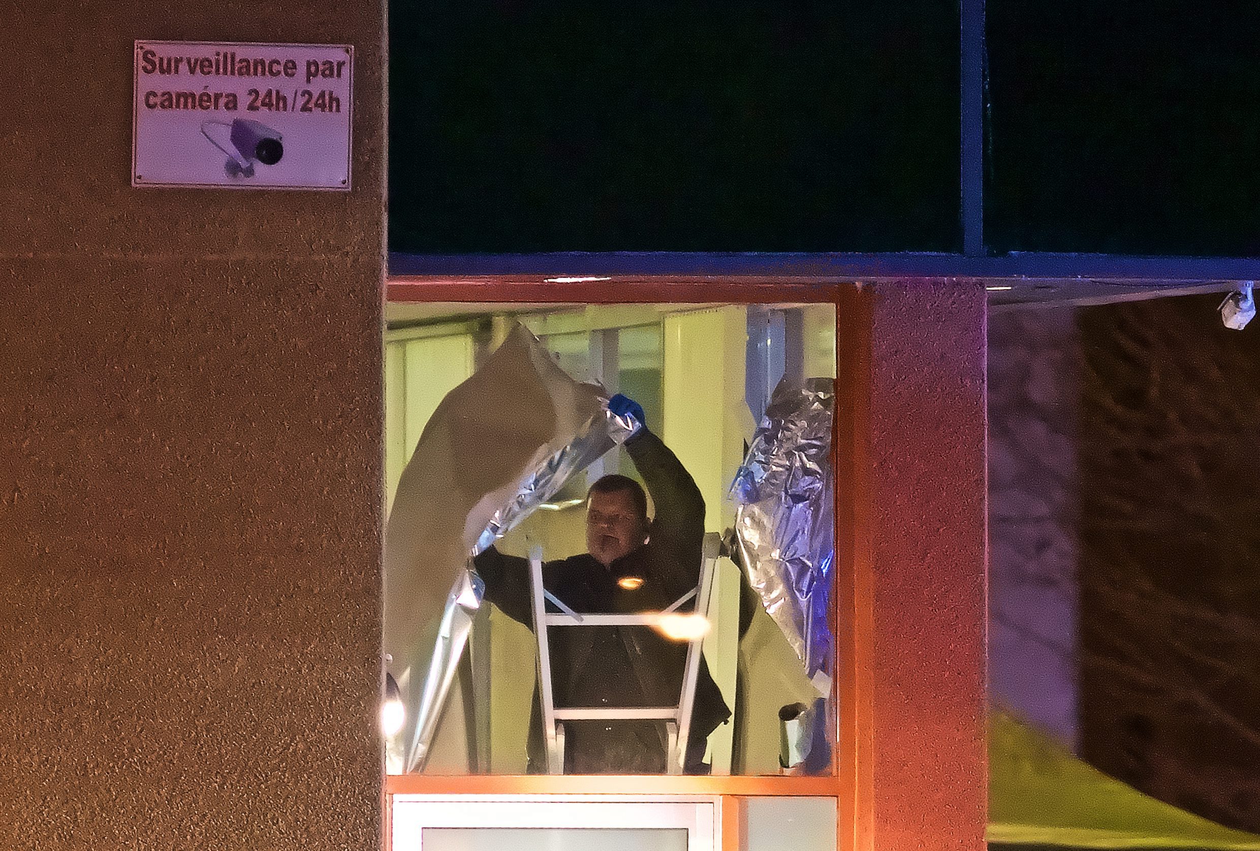 Police hung up paper to cordon off the crime scene at the mosque.