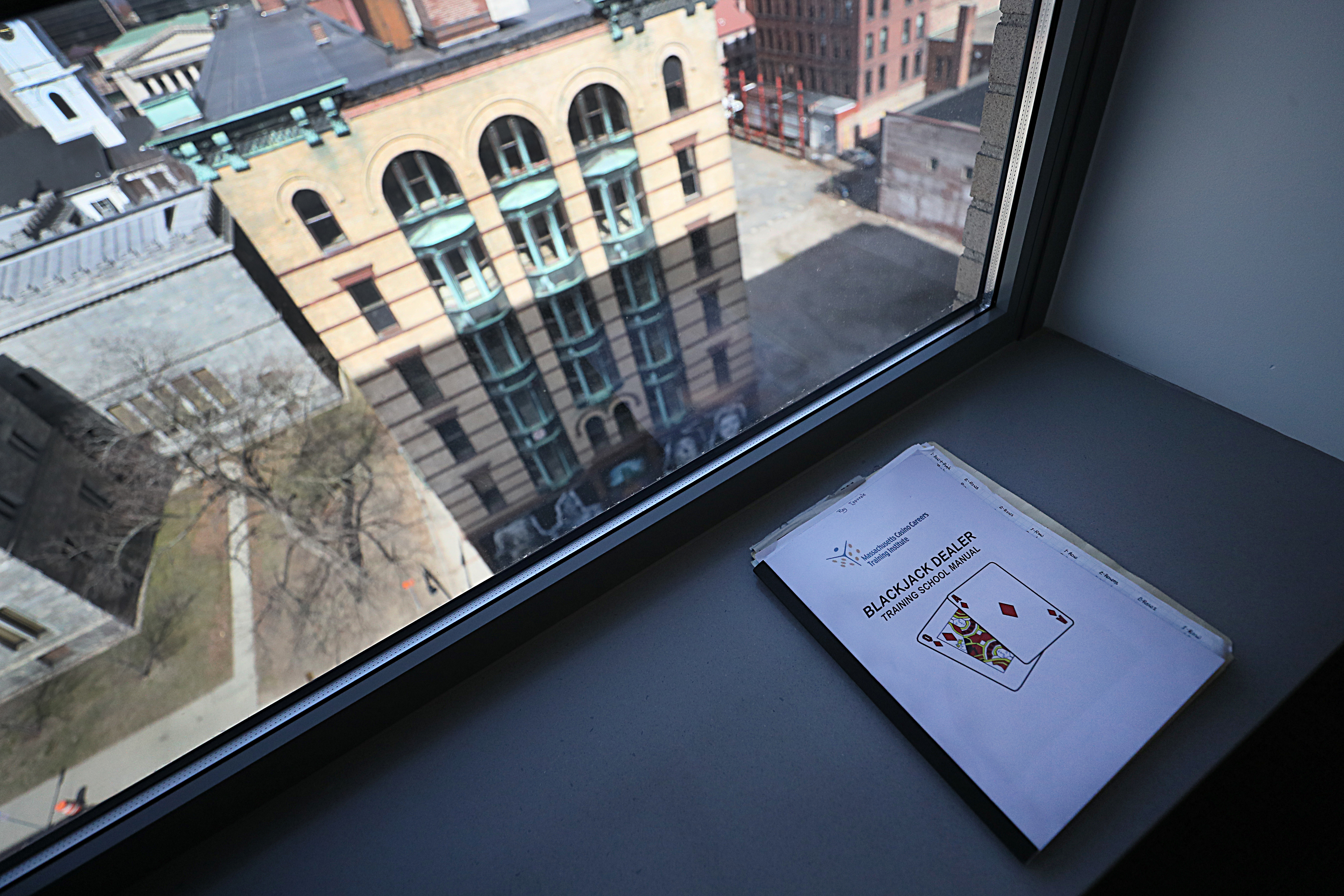 A blackjack manual in a window overlooking downtown Springfield.