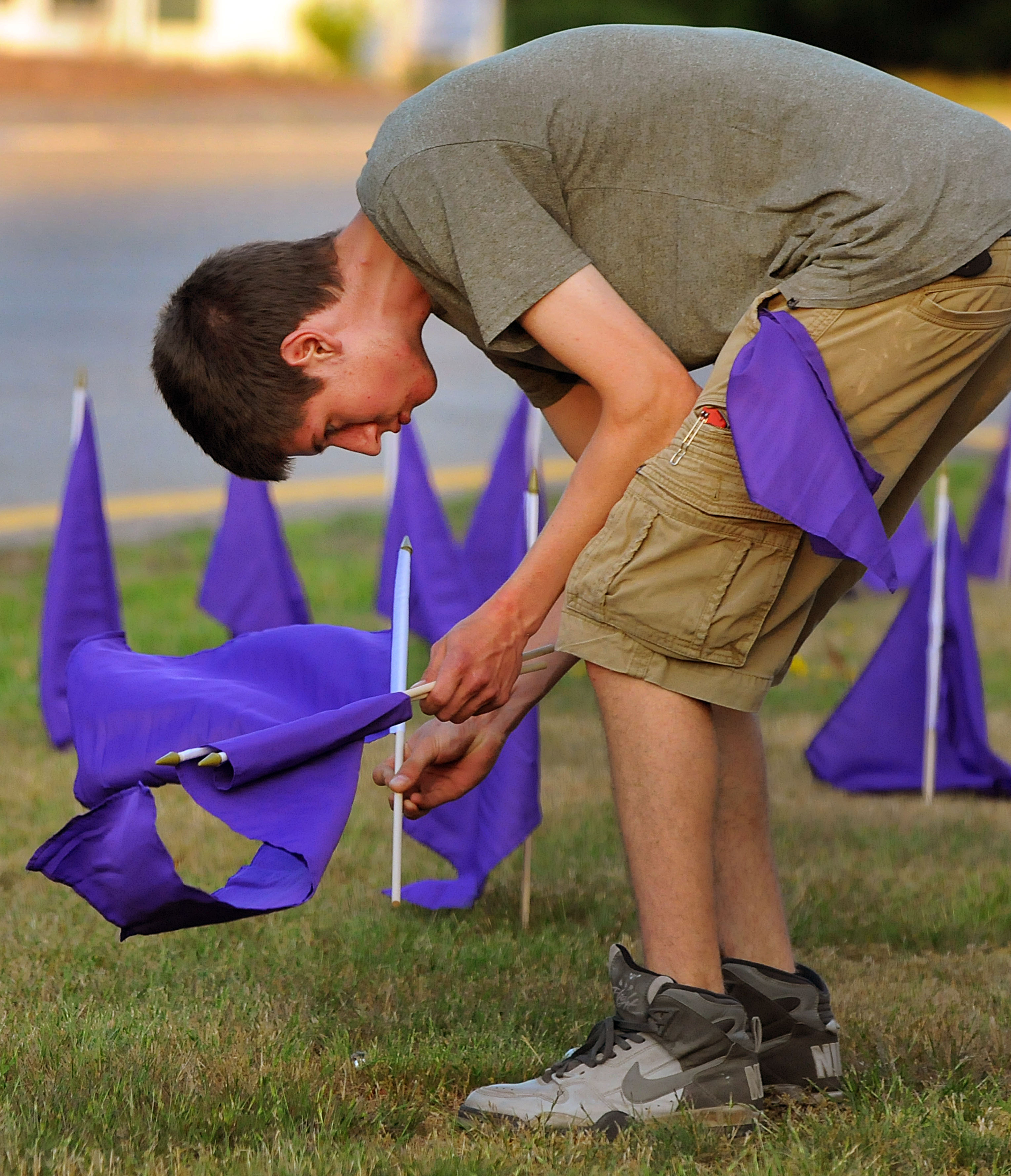 Mashpee resident Alex Eaton, who lost a good friend, Will Damon to an overdose, helped place three hundred and thirty three purple flags in the Mashpee rotary.