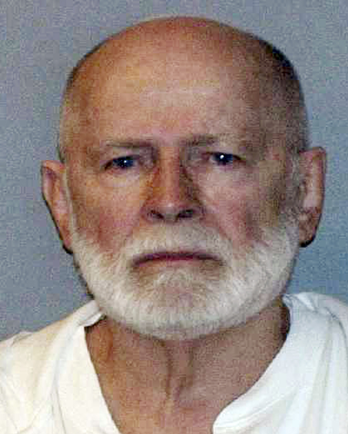Lawyers for James “Whitey” Bulger, here in his June 2011 booking photo, say the former FBI informant’s handlers promised him he would never be prosecuted for any of his alleged crimes, including murder.