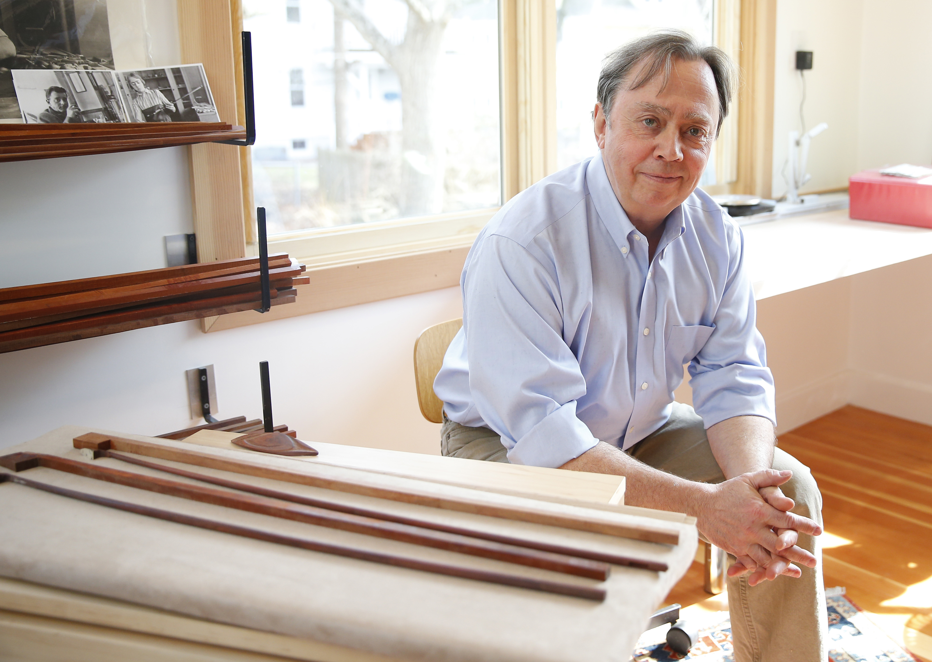 MacArthur-winning bow maker Benoit Rolland posed for a portrait in his home studio in Watertown.