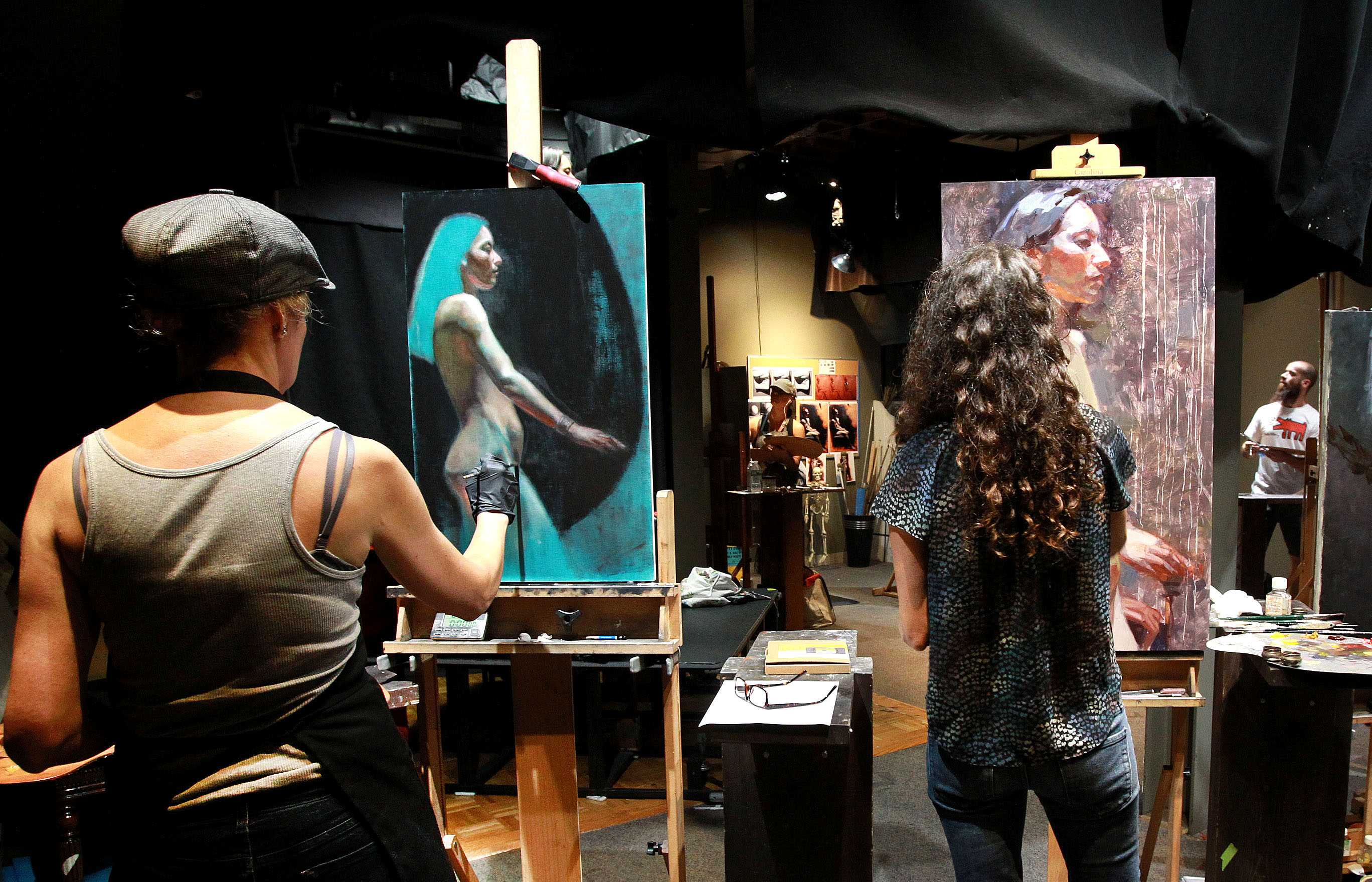 From left: Emanuela De Musis, Jennifer Balkan, and He Lihuai at work during the 2016 Boston Figure Painting Competition.