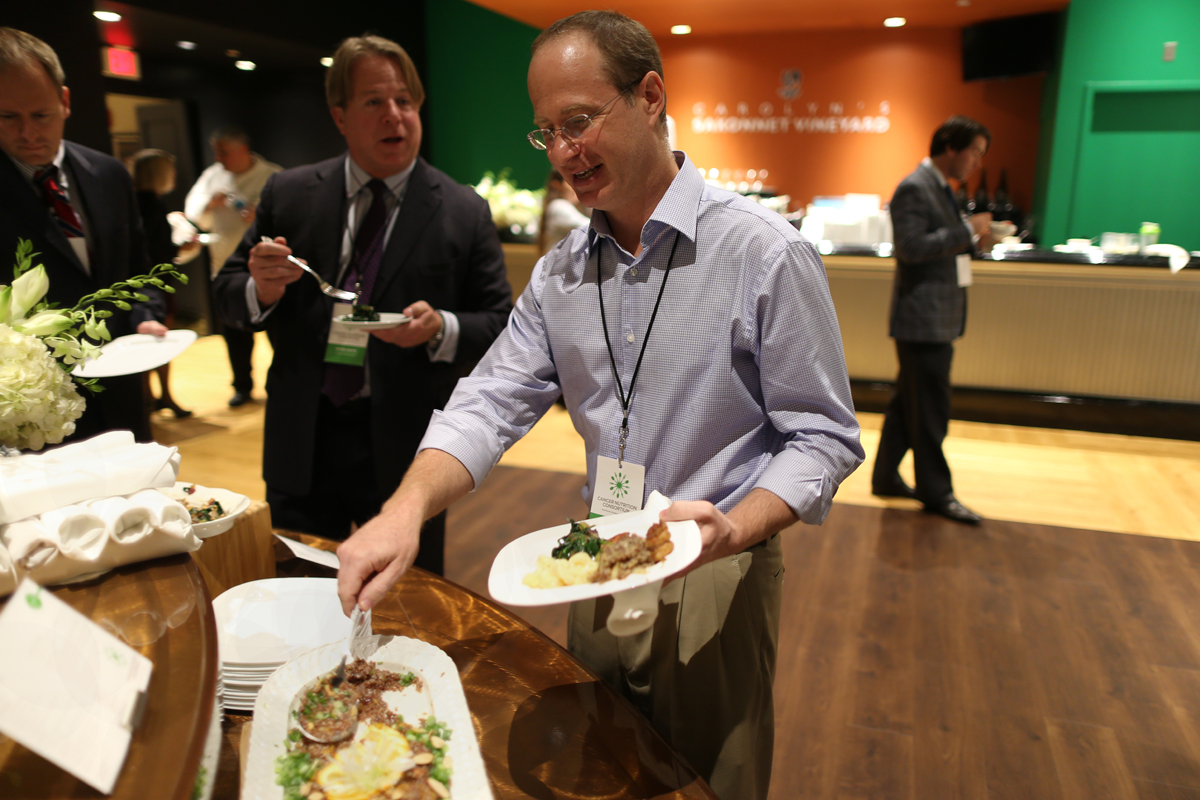 Jeff Sirlin (foreground) says he’s slowly regaining weight and strength he lost during his cancer treatment with food similar to what was prepared by the Cancer Nutrition Consortium.