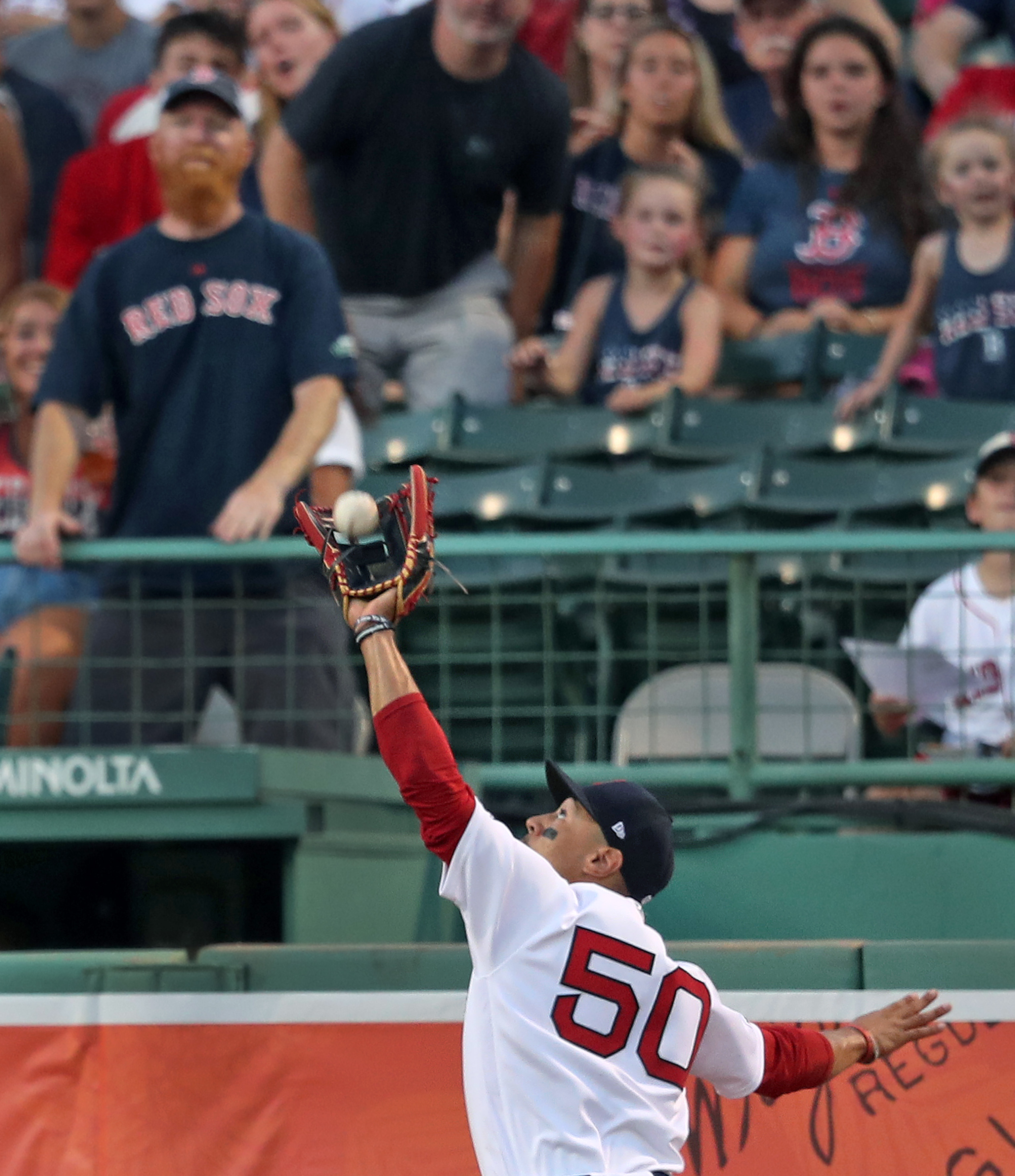Right fielder Mookie Betts makes a nice running catch to take a hit away from Guillermo Heredia and end the second inning Tuesday.