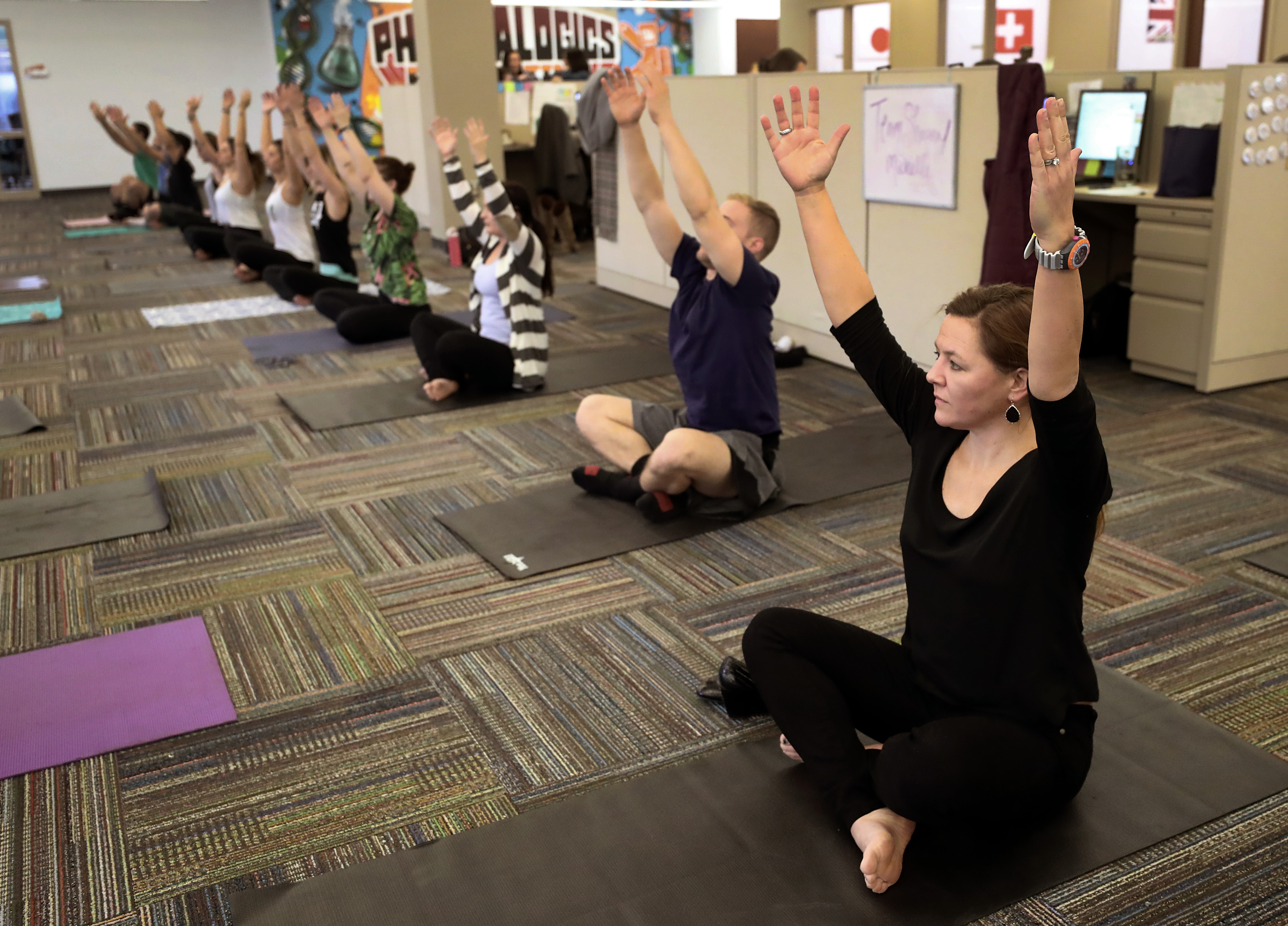 Driscoll participated in a yoga class at PharmaLogics.