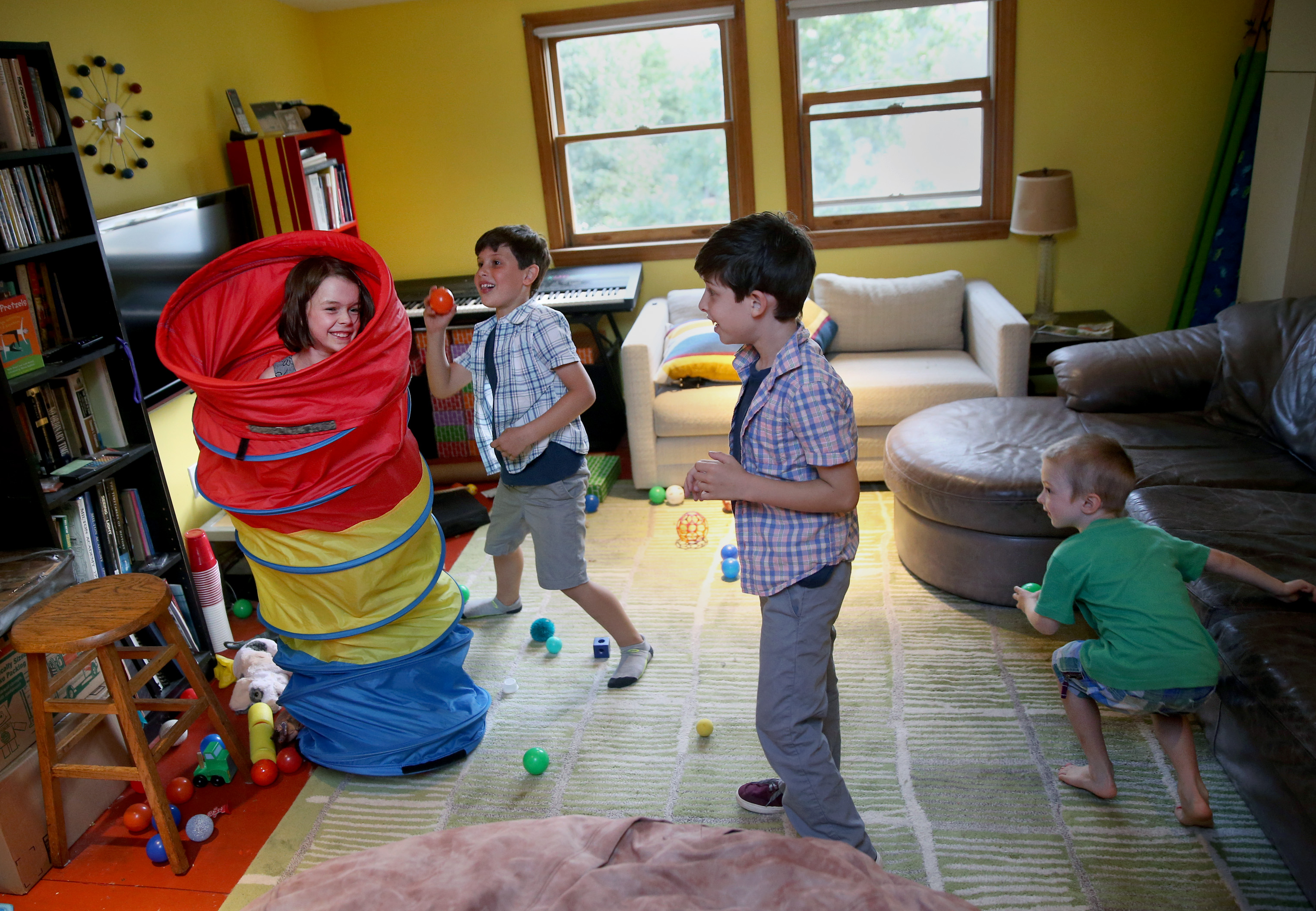 From left, Eloise Pikcilingis, 7, Truman Faroni, 7, Alden Faroni, 8, and Milo Pikcilingis, 4, play on the third floor of their families’ home.