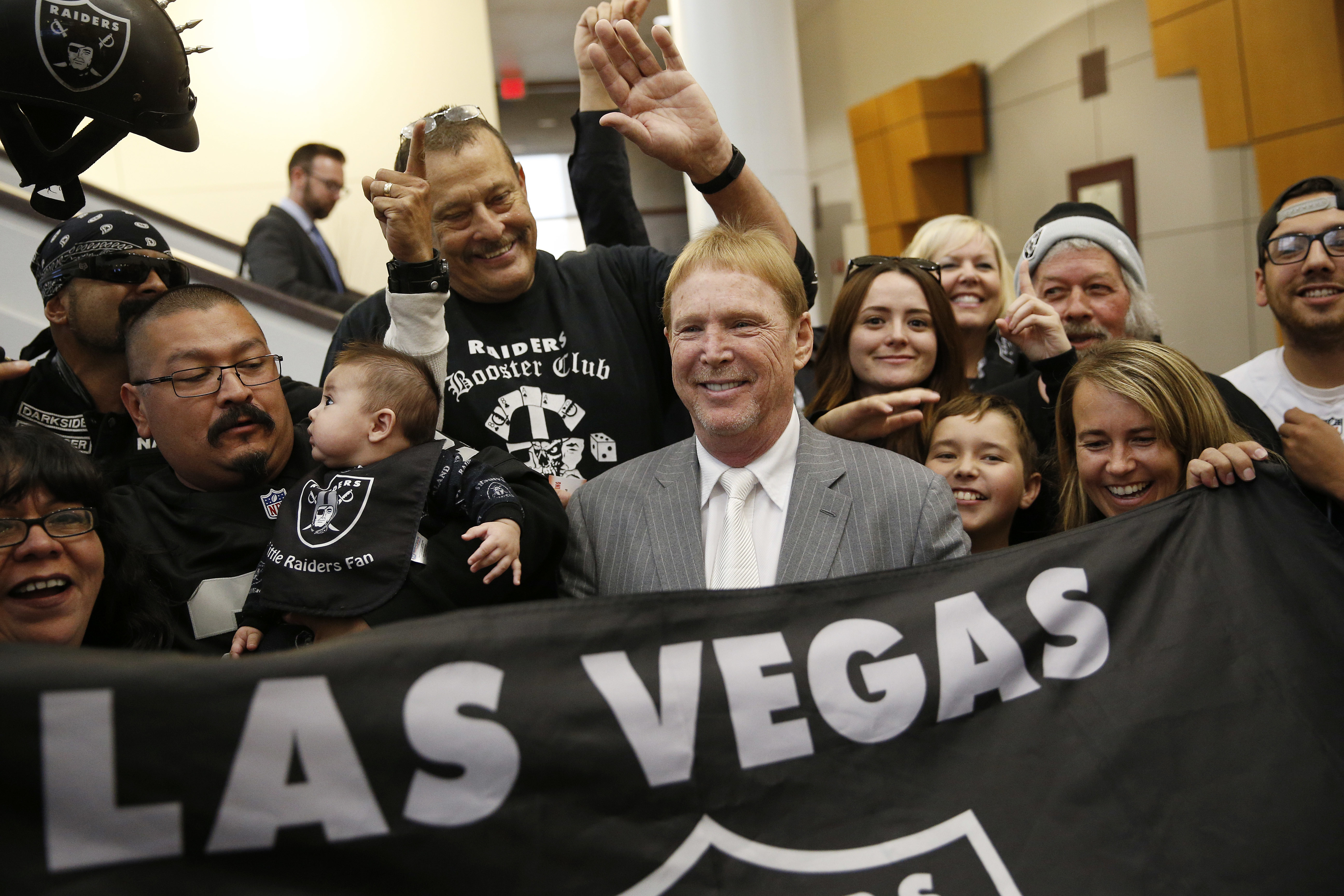 Raiders owner Mark Davis (center) met with Raiders fans after speaking at a meeting of the Southern Nevada Tourism Infrastructure Committee in April 28.
