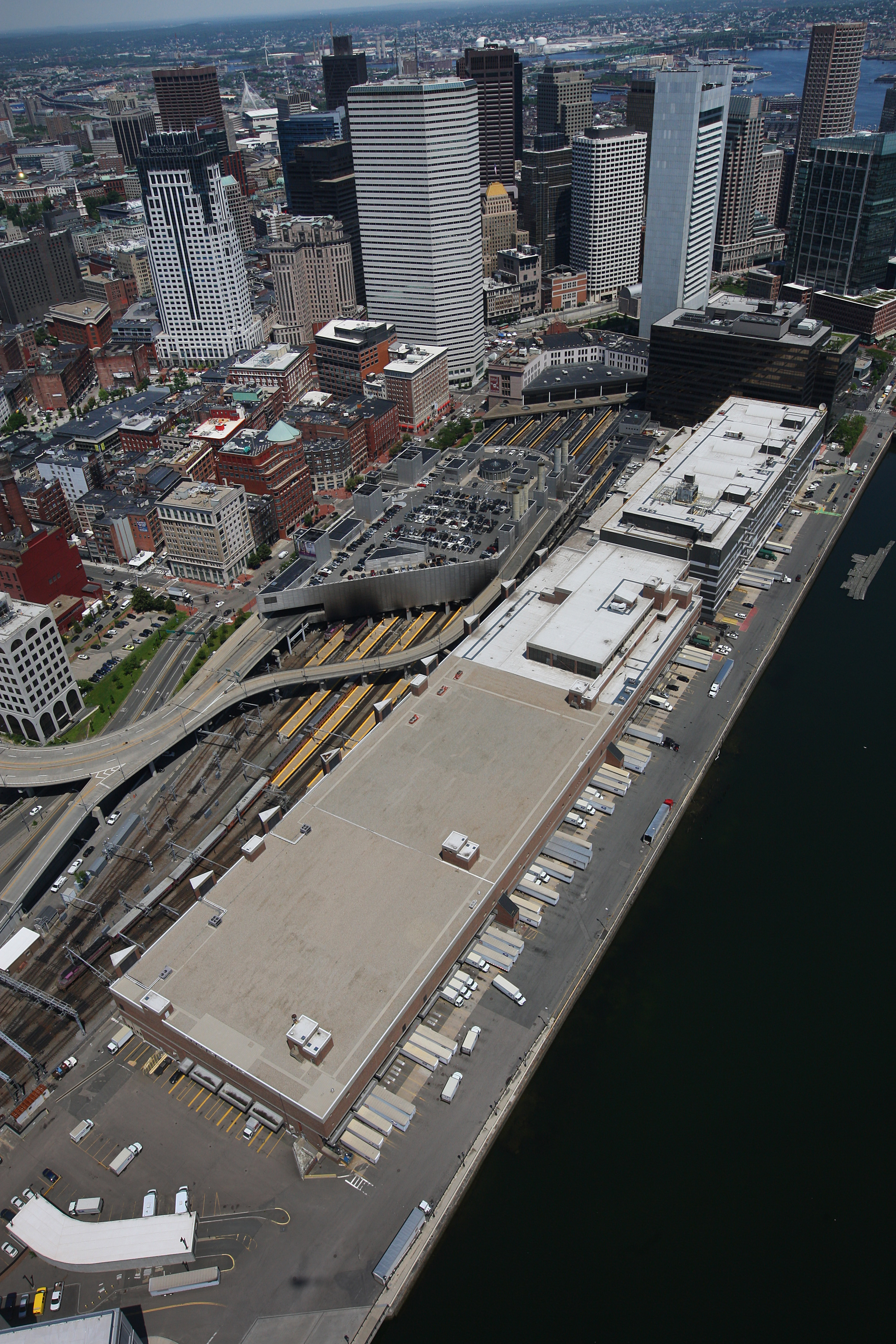 The Postal Service’s massive facility on Fort Point Channel would be demolished to make way for the expansion of South Station if the state gets its way.