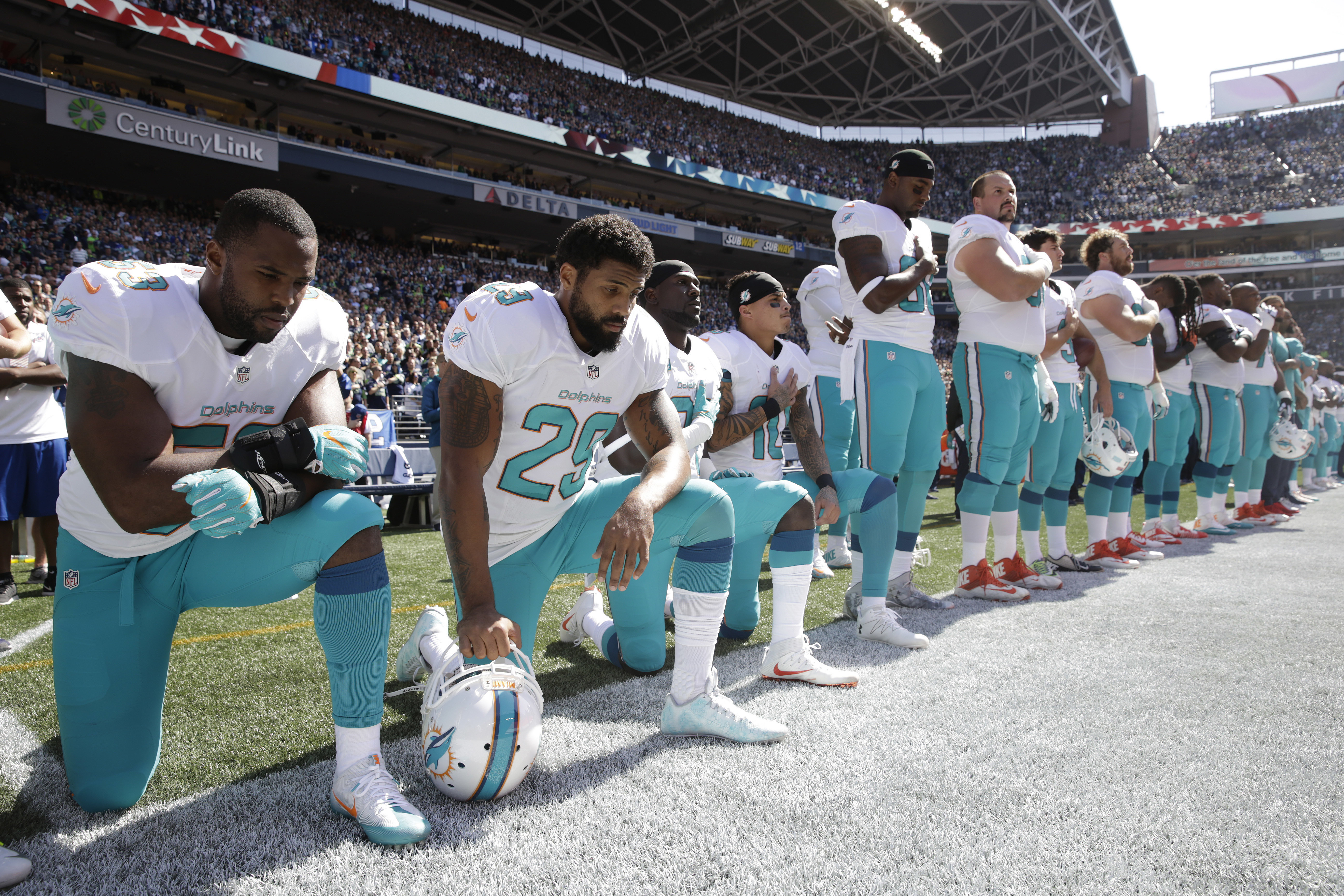 Some of the Miami Dolphins players knelt during the singing of the national anthem before an NFL football game against the Seattle Seahawks in Seattle in 2017.