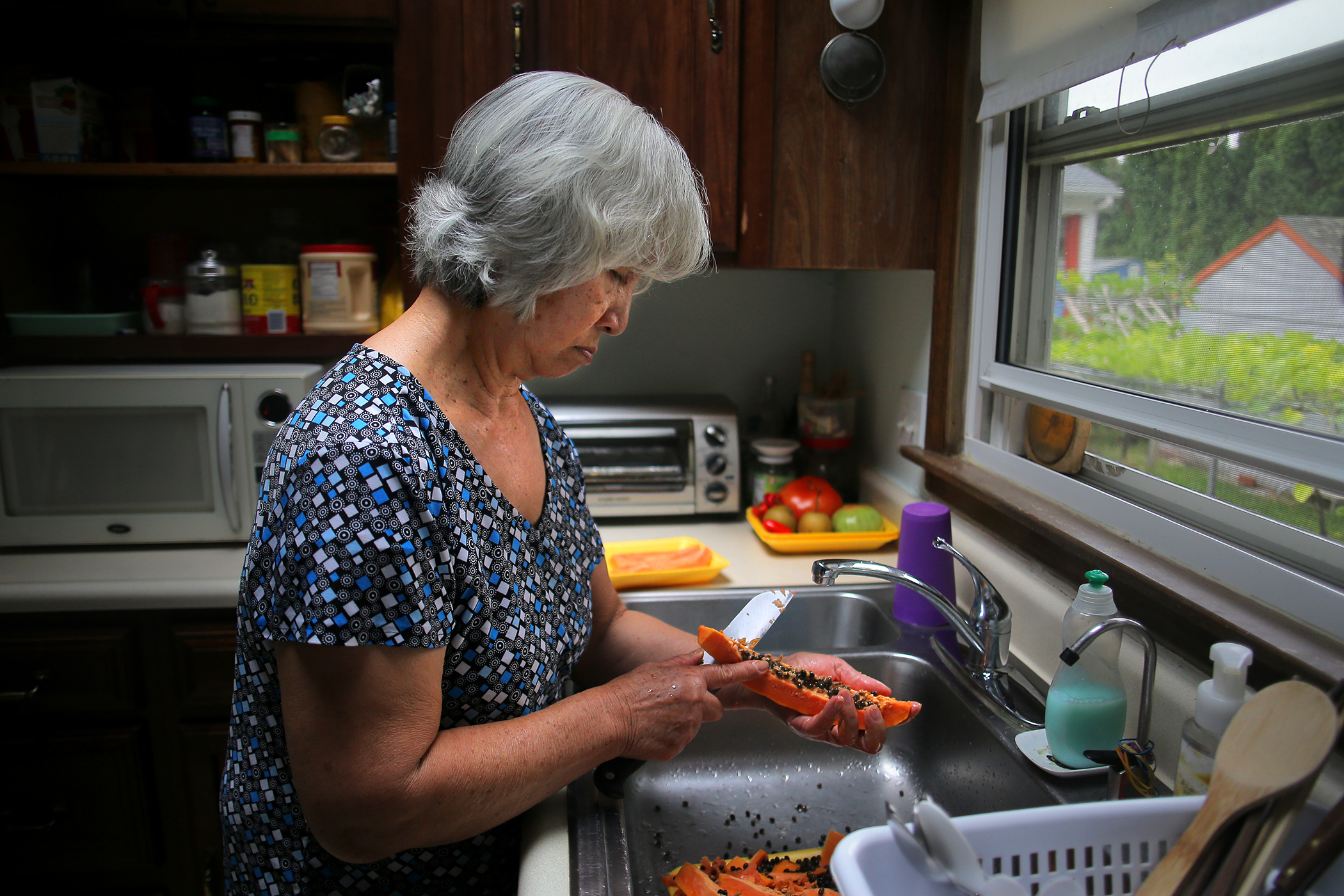 Anh Tran must wash dishes with cold water, which hurts her sensitive hands with winter approaching.
