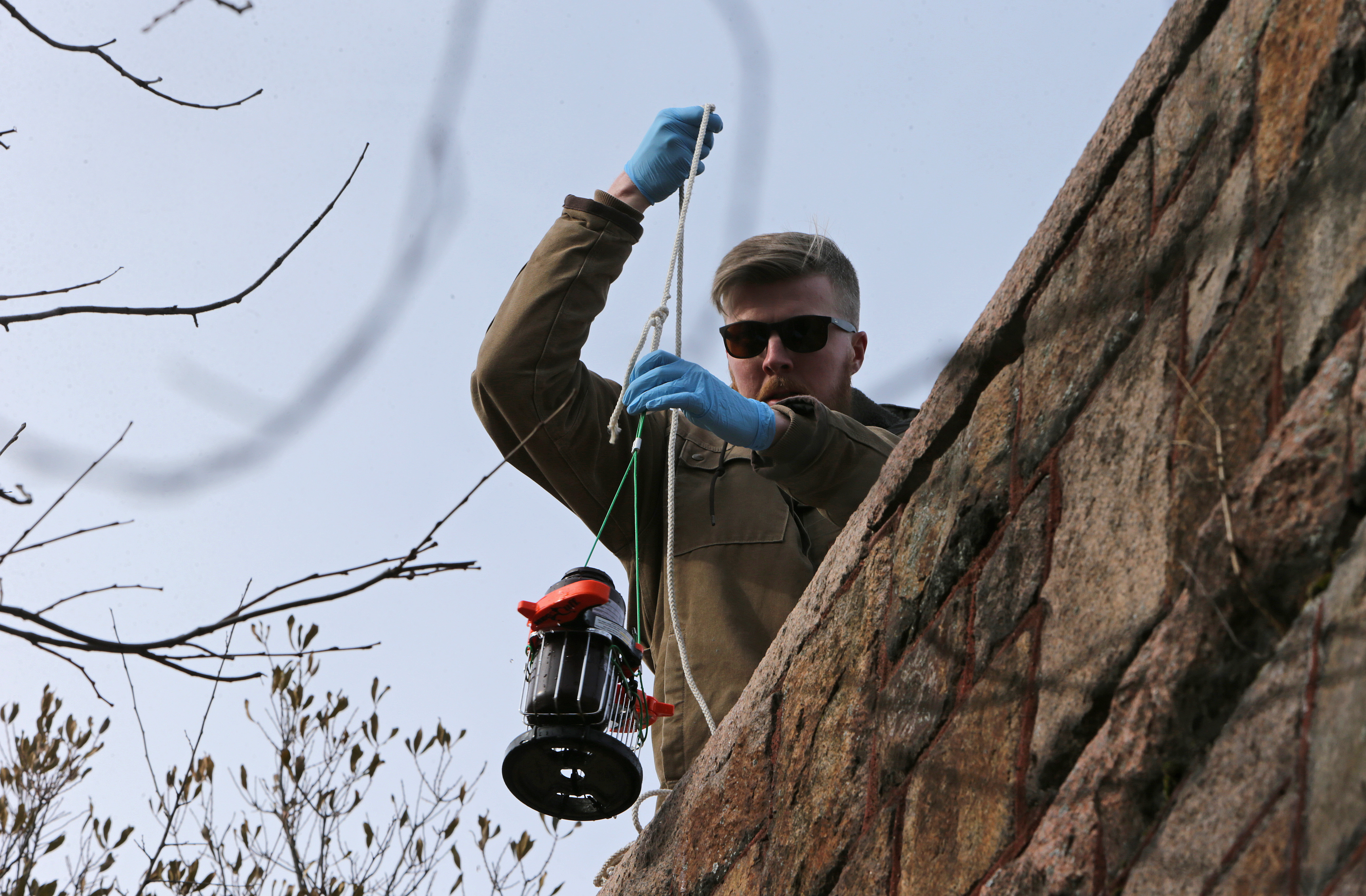Richard Treanor, a watershed association intern, drew water from Leverett’s Pond.