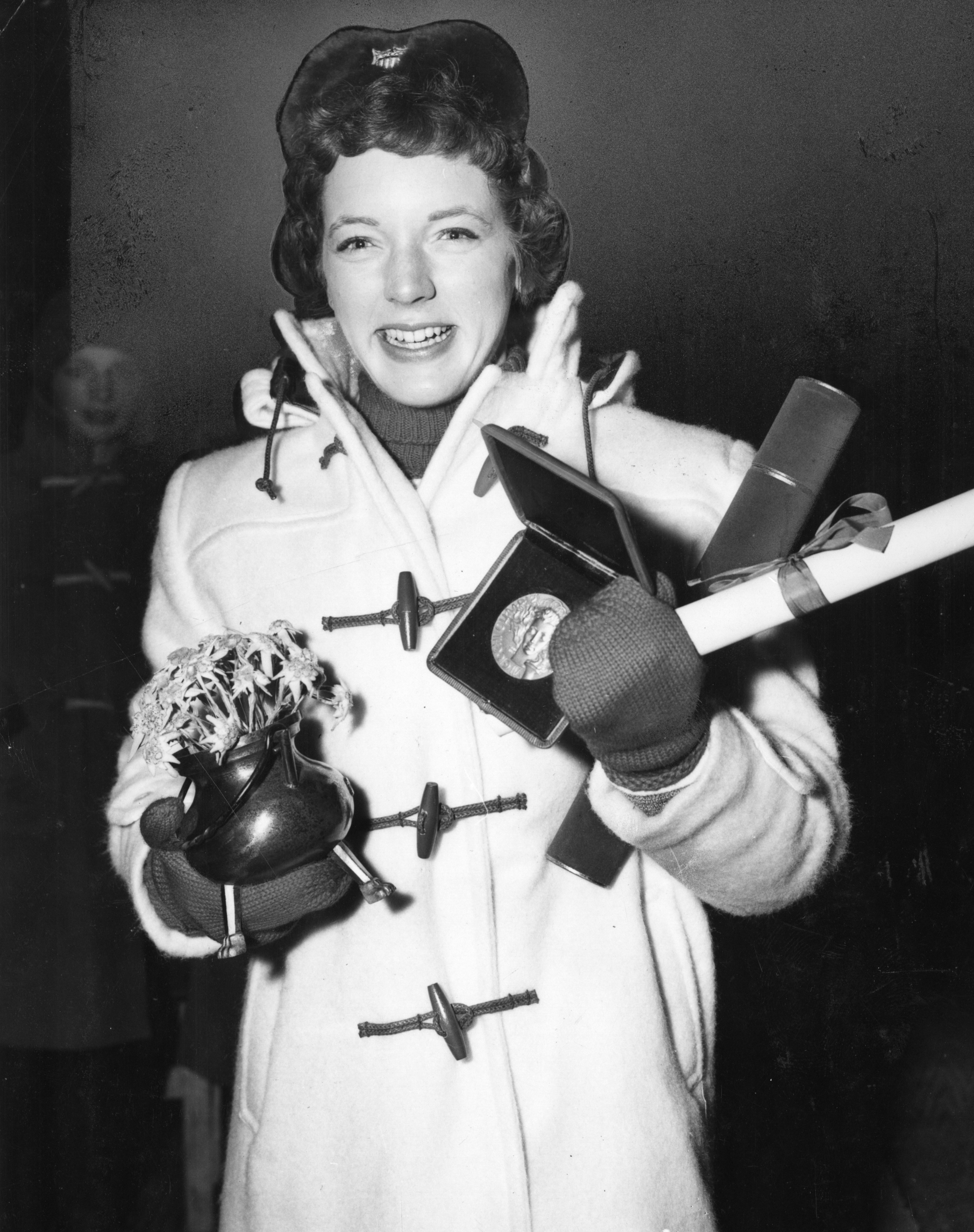 Albright clasps her awards after the Olympic ceremony.