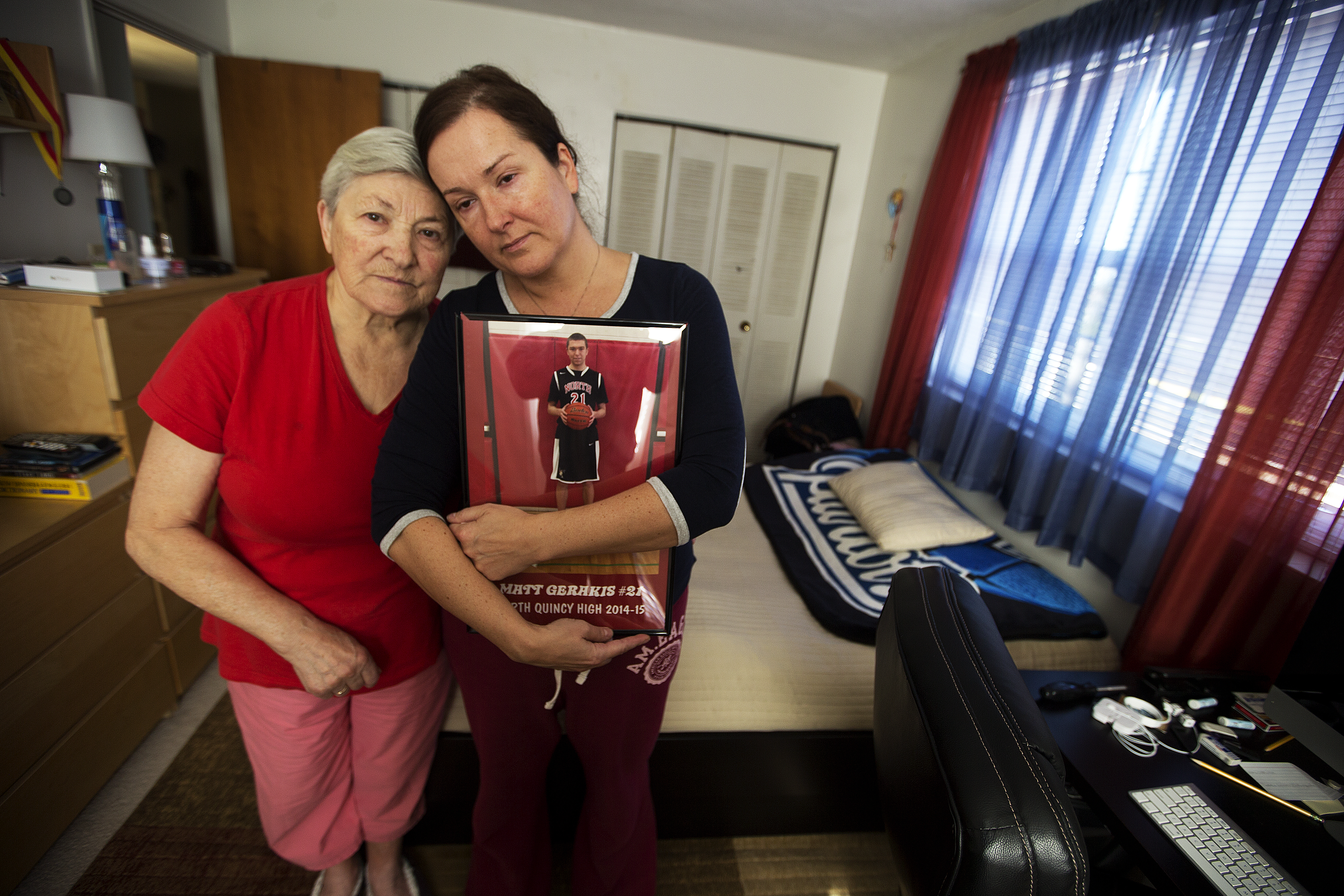 Matt Gerakis’ grandmother, affectionally called “Babcia” which means grandmother in Polish, and his mother with his portrait in his bedroom just across the street from the train tracks where he committed suicide on Oct. 16.