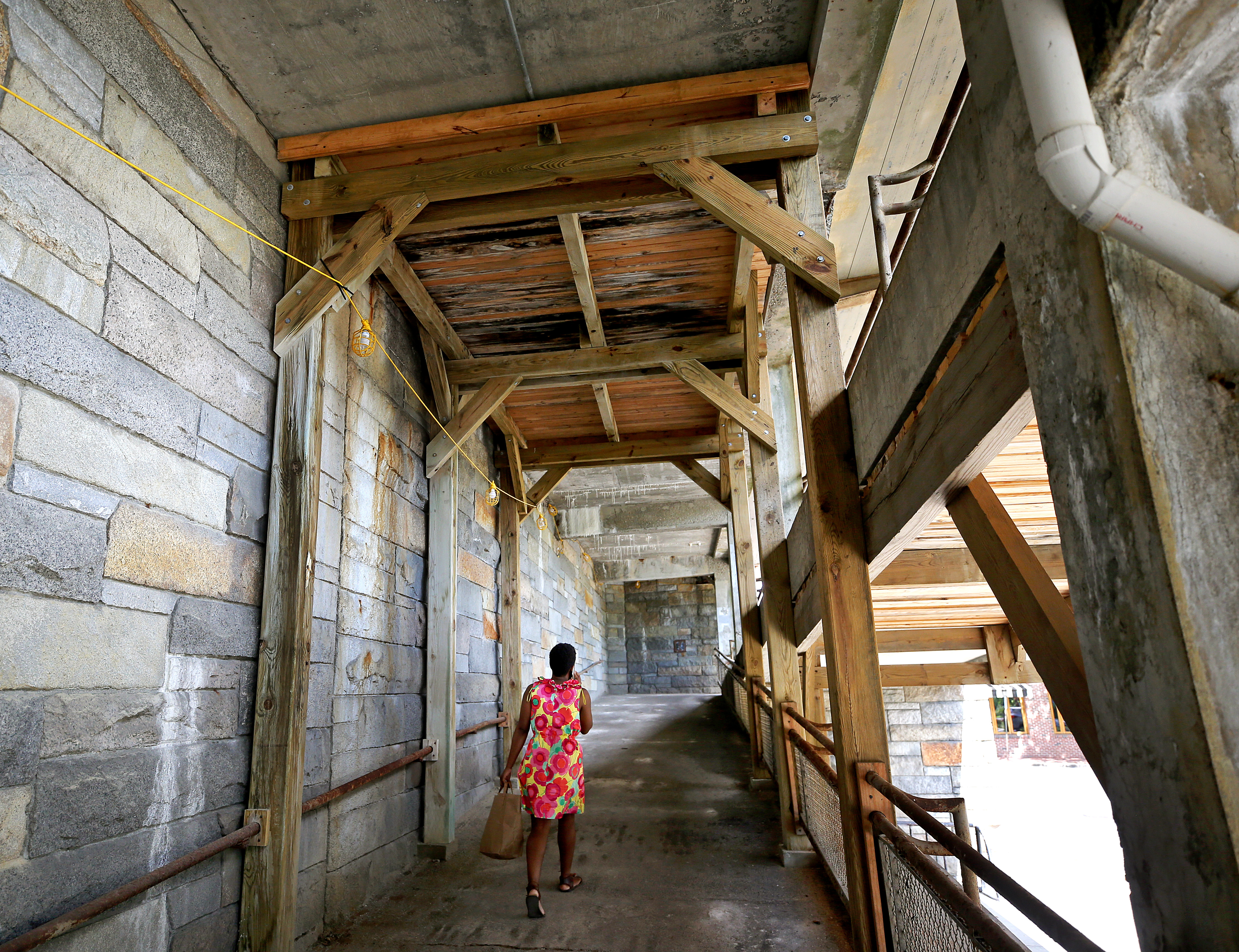 Corroding ramps at the commuter rail station in Winchester are patched with plywood, and exposed rebar peeks from the canopy overhead.