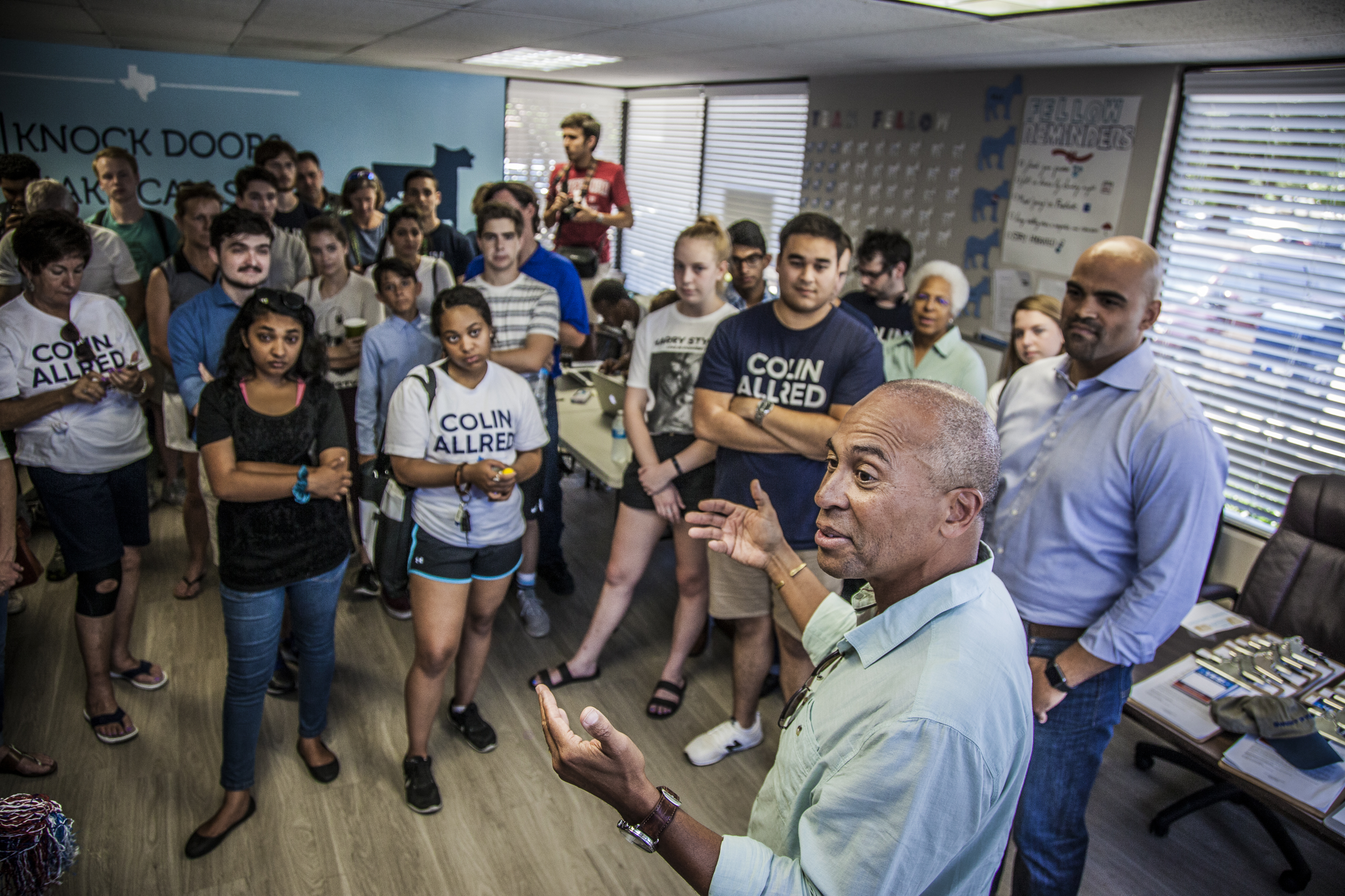 Former Massachusetts Governor Deval Patrick campaigns for Colin Allred (far right), who is running for Congress in Texas, during an appearance at Allred's campaign headquarters in Richardson, Texas.
