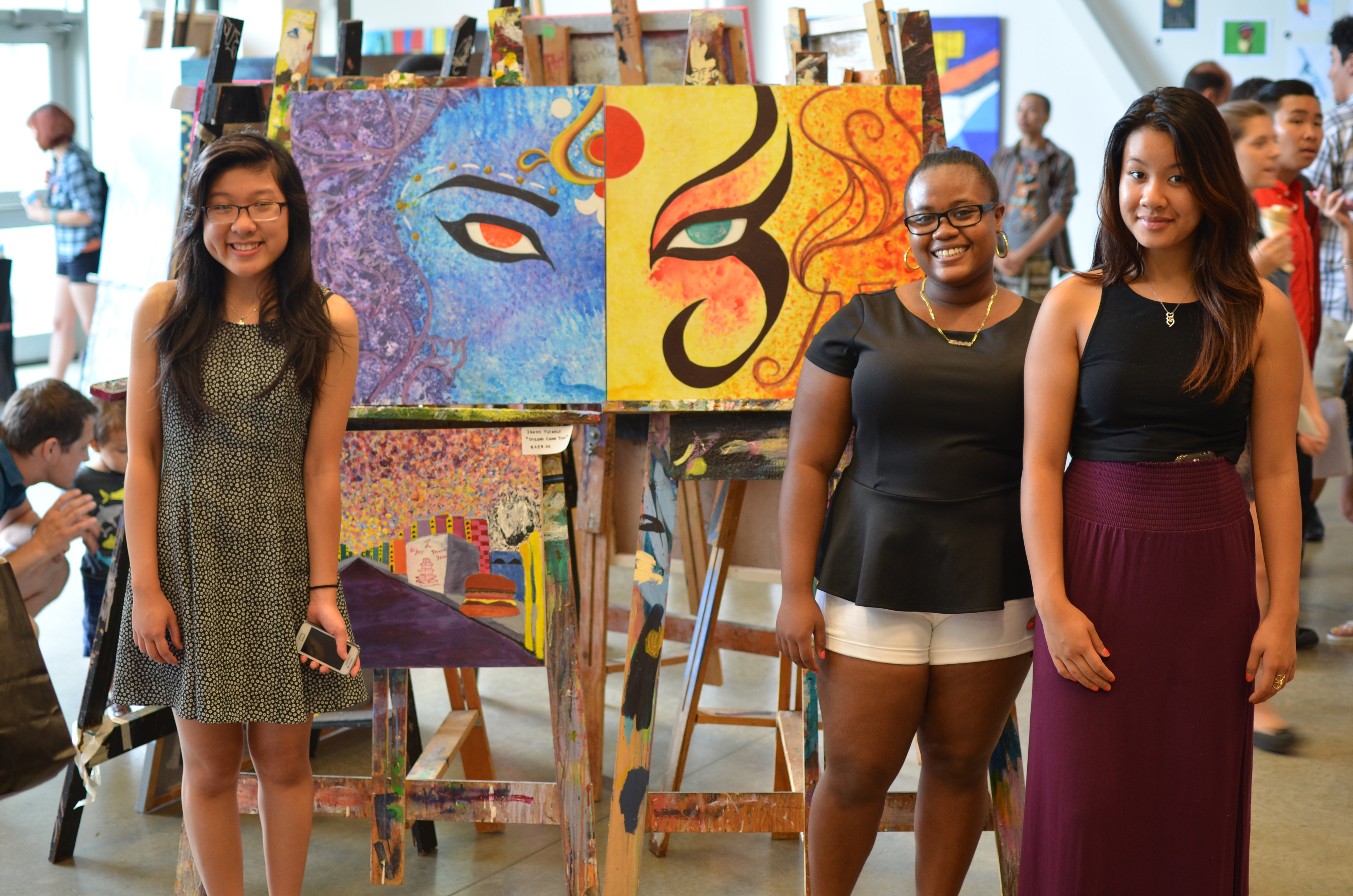 From left: Kim Pham, Mykala Goods, Kim Han at Artists for Humanity’s annual summer art exhibition at the EpiCenter.