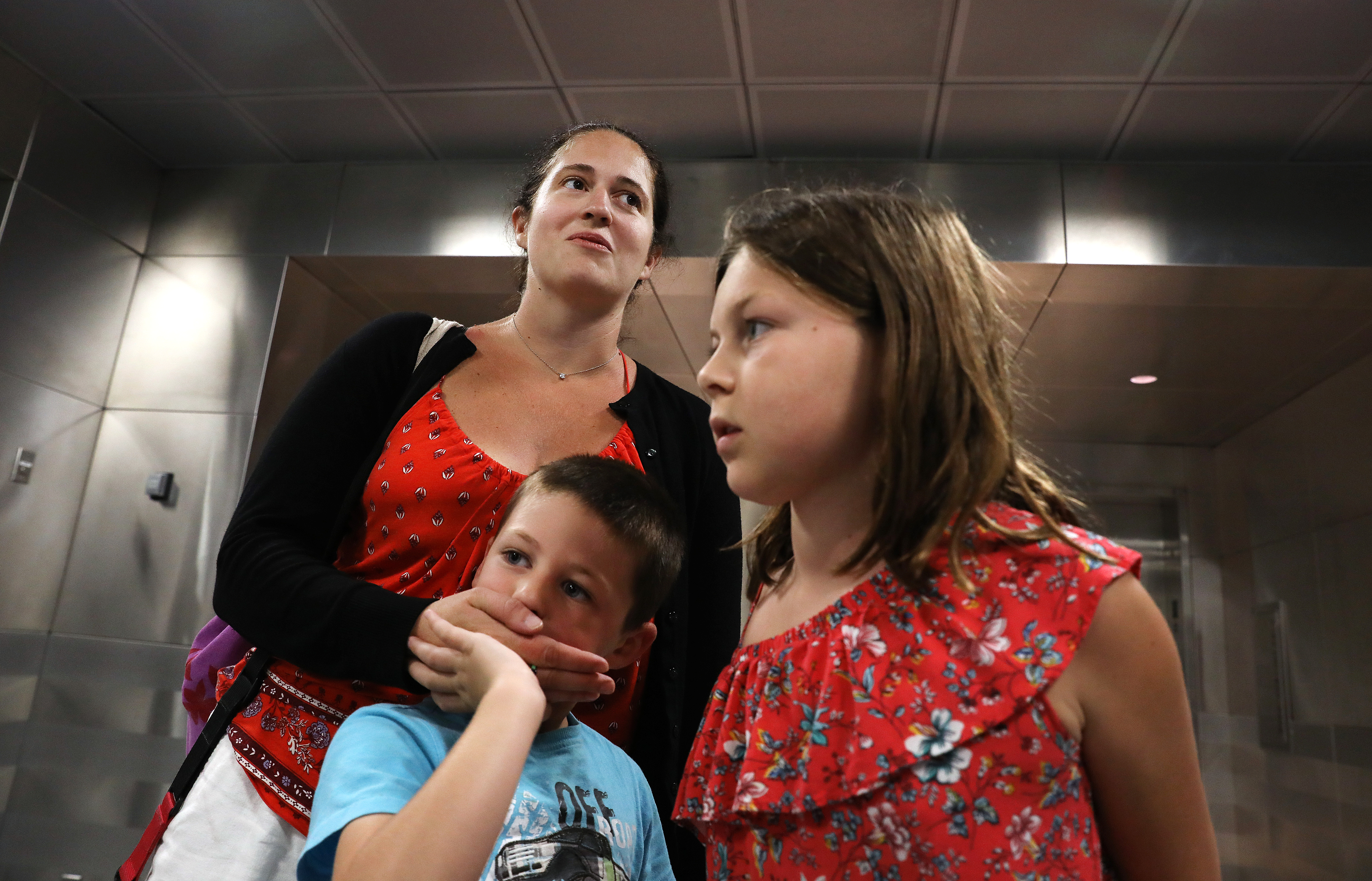 Lorelai Collette, right, wanted to come back a day earlier because she was afraid of the hurricane. With her are her mother Meghan Collette, and 5-year-old brother Sam Collette. They live in Ashland.