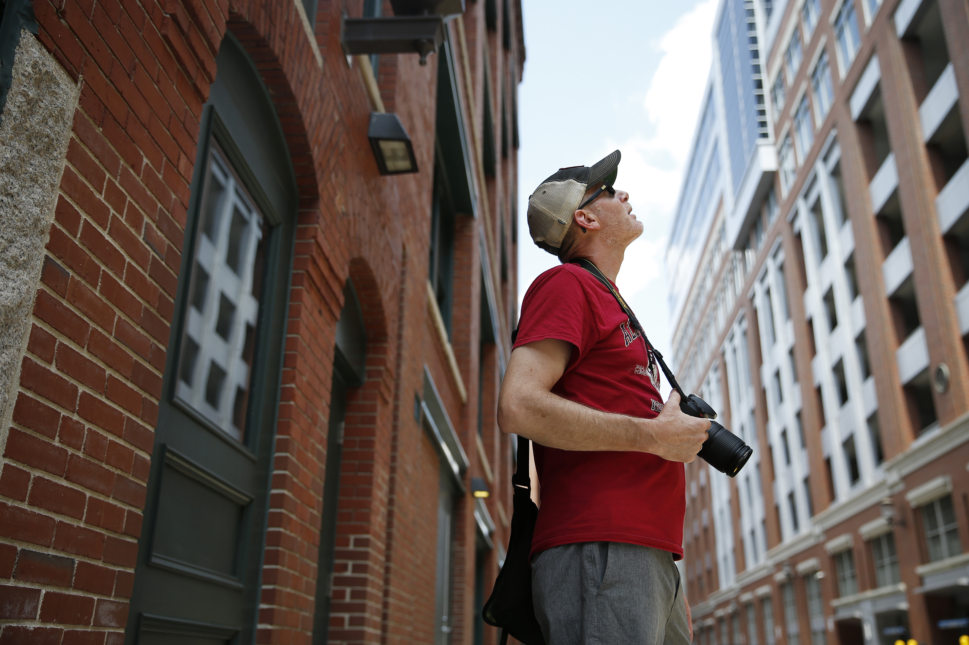 Dave Brigham, a history buff from Newton, looked for ghost signs as he walked around the Seaport District.