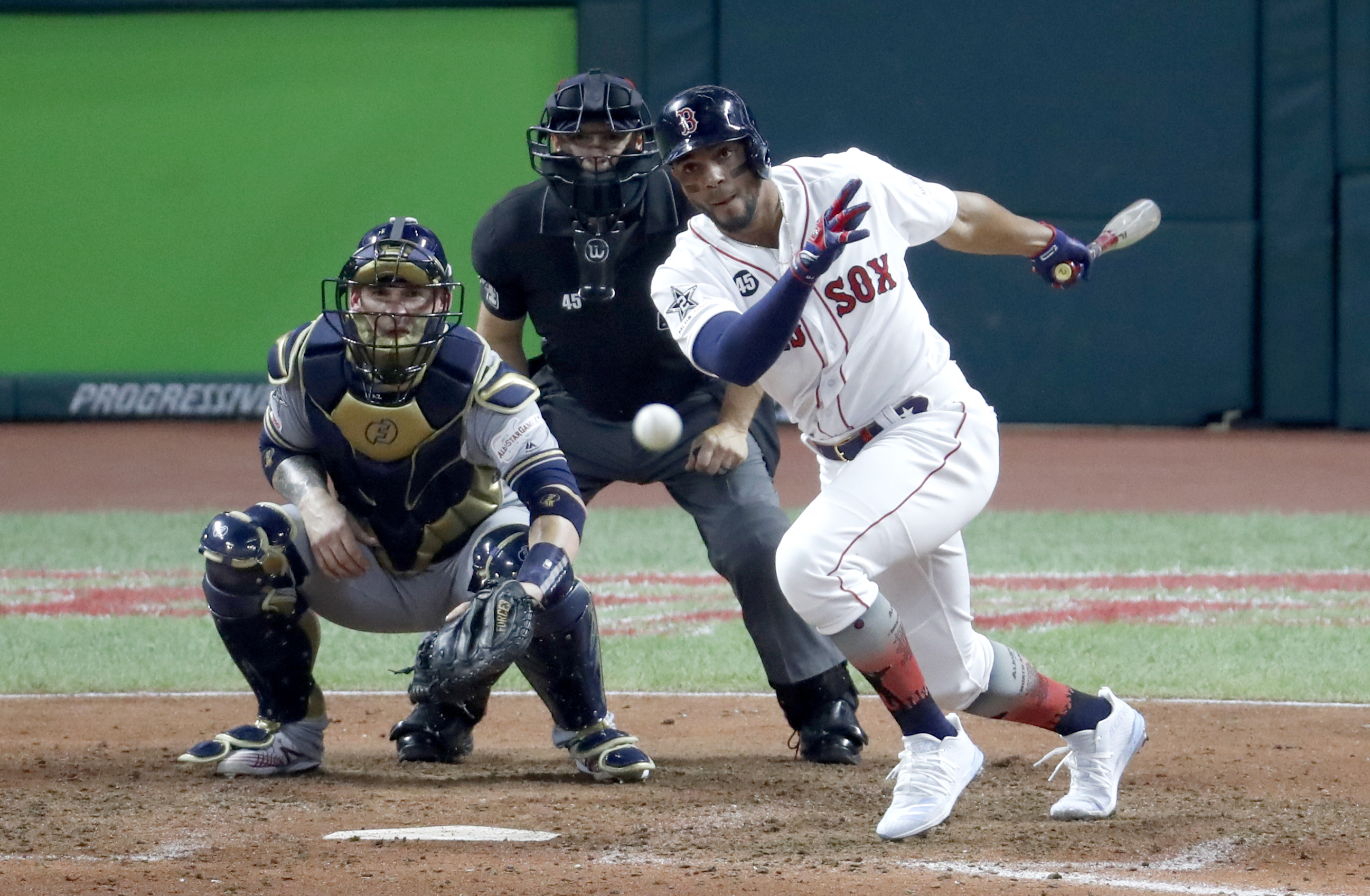 Xander Bogaerts hits into a double play, which brought home a run during the seventh inning of the All-Star Game in Cleveland.