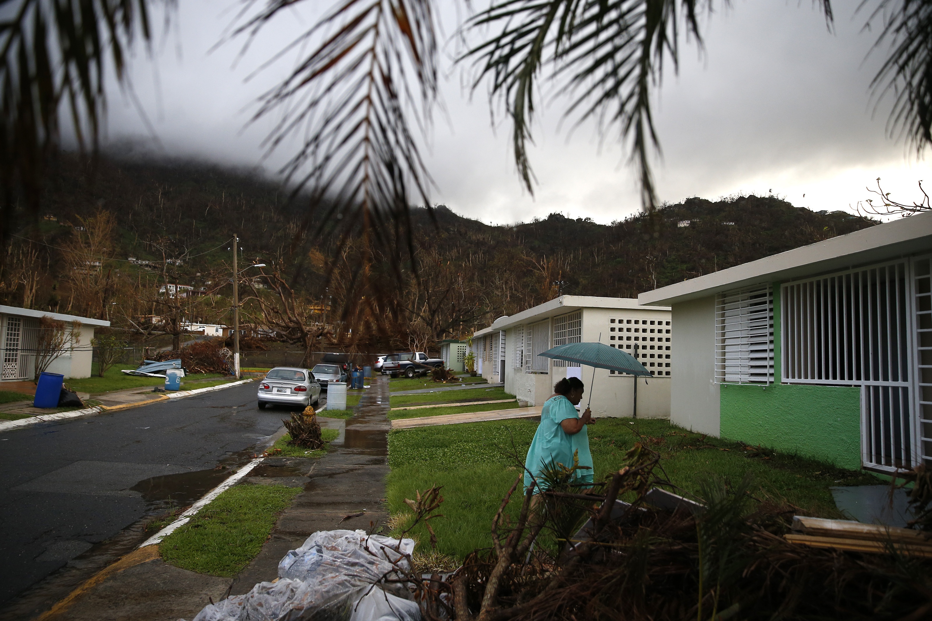 Carmen Charriez walked across the street to the home they are moving into in Yabucoa.
